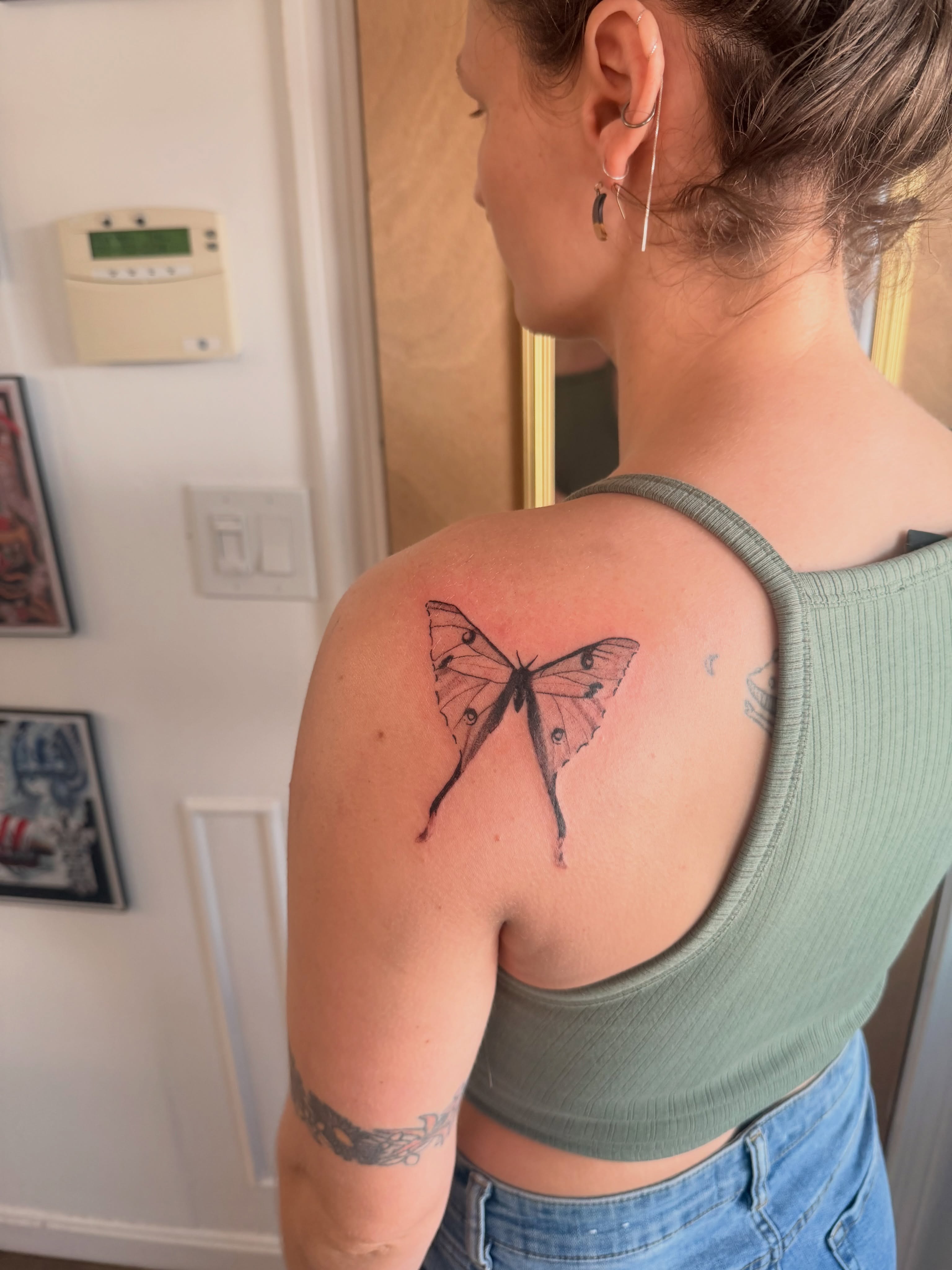 Butterfly realism tattoo on the shoulder by Alaska
