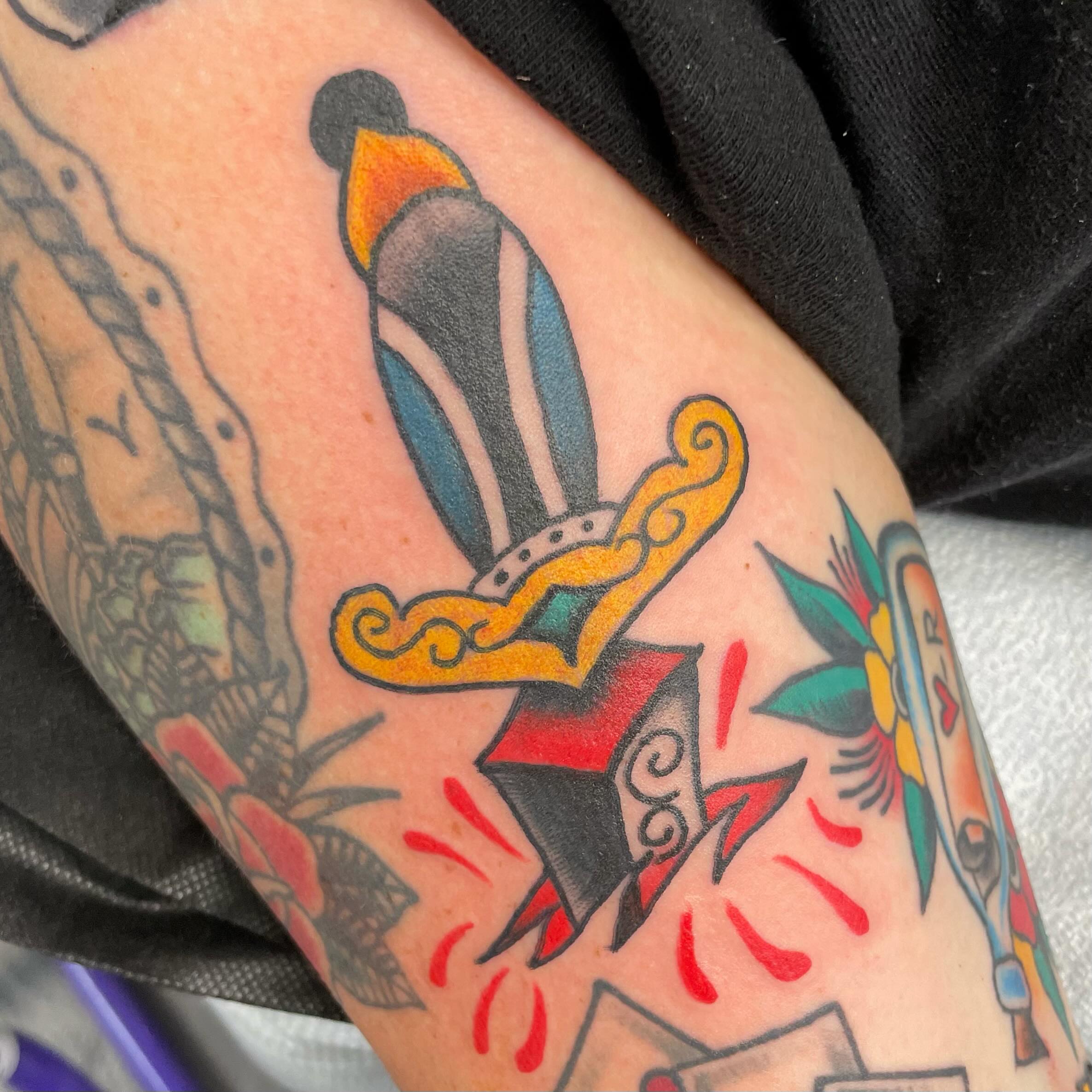 Sword and flame American traditional tattoo on the forearm by 𝐒𝐚𝐦𝐬𝐨𝐧𝐋𝐚𝐳𝐚𝐫𝐭𝐞