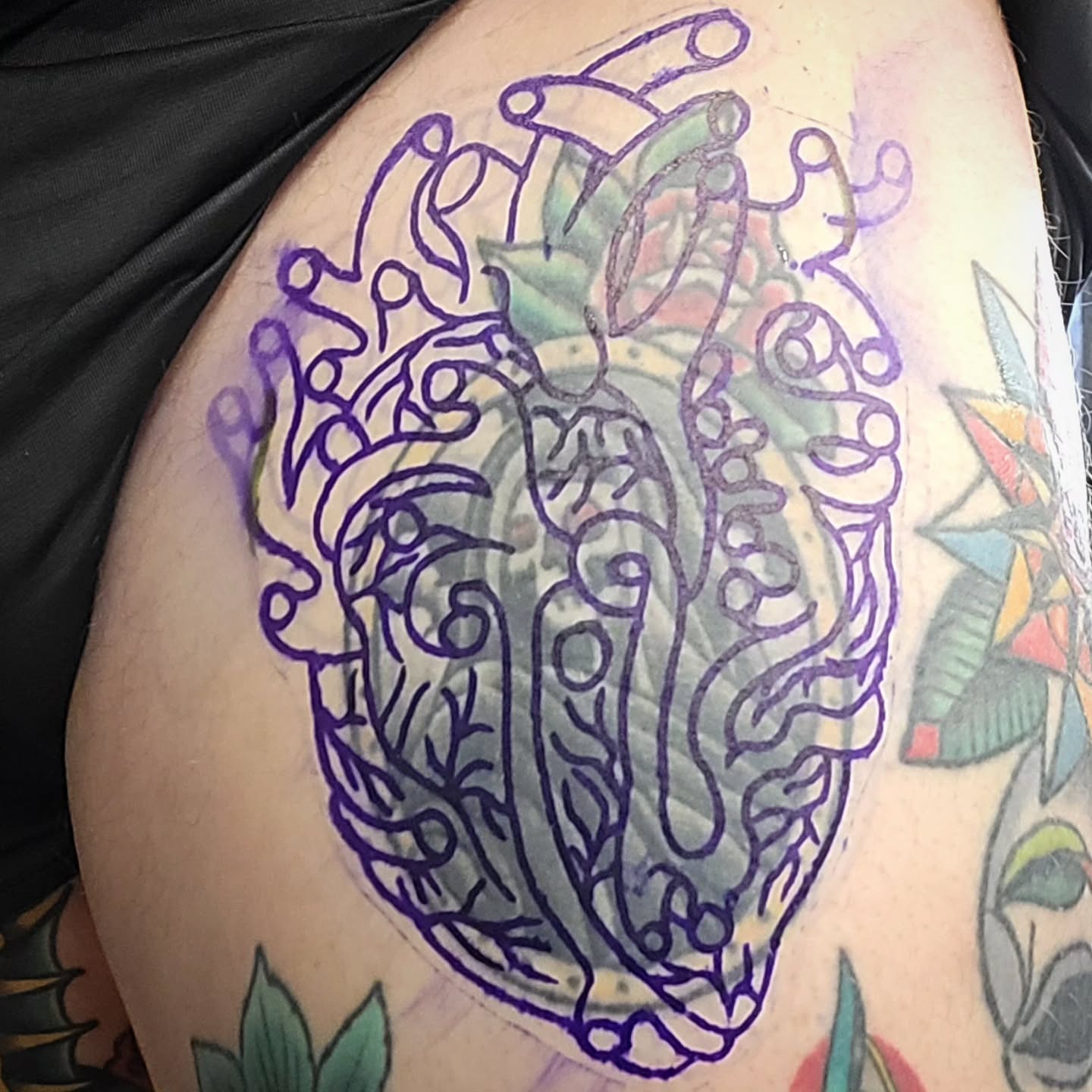 Abstract design ornamental tattoo on the thigh by Sloan Smith
