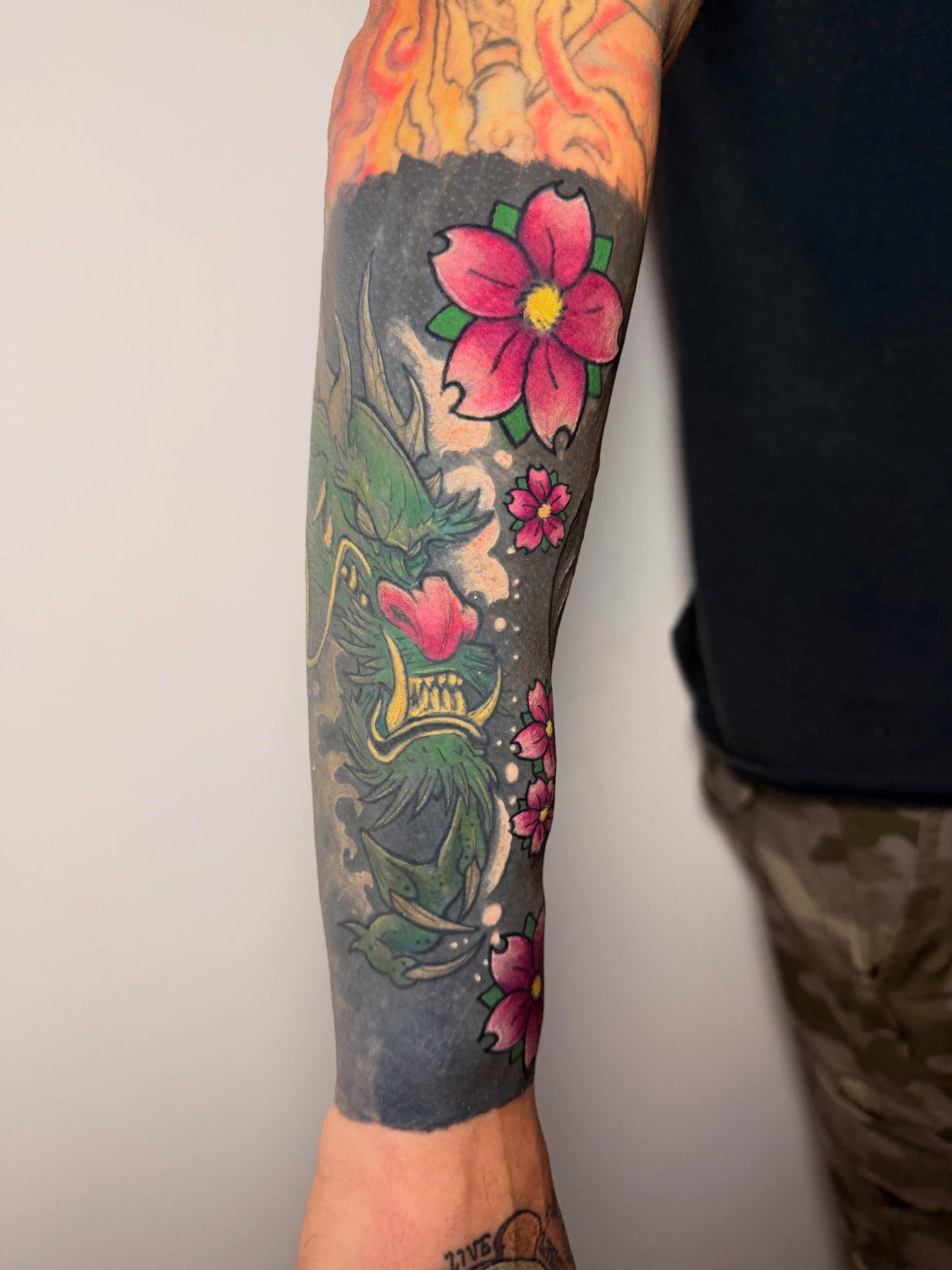 Floral and dragon American traditional tattoo on the forearm by Gabrielle Frelak, York, Pennsylvania