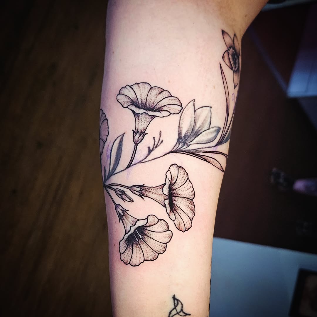 Flowers and butterfly dotwork tattoo on the forearm by Isaac Morales