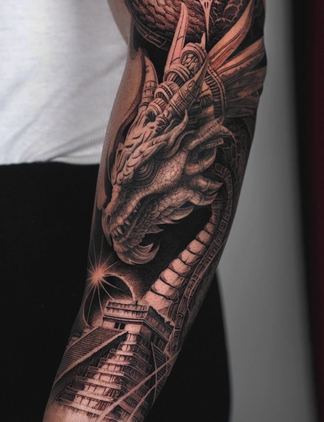 Dragon and pyramid Japanese tattoo on the forearm by Sumok Kim