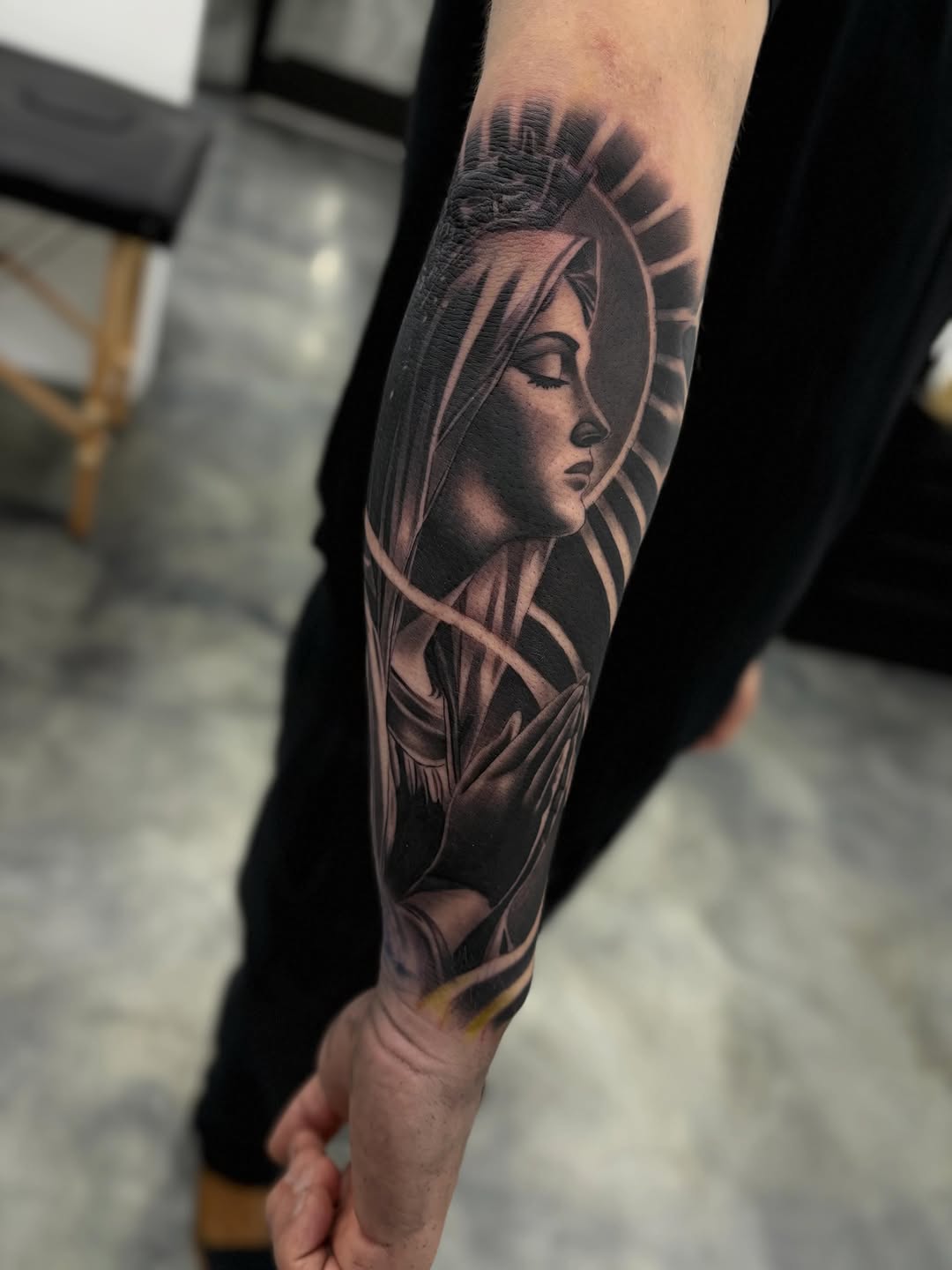 Virgin Mary praying Chicano tattoo on the forearm by Devin