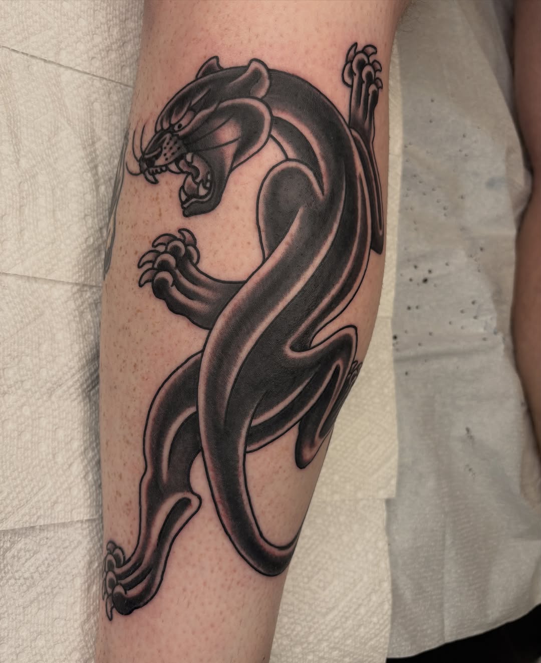 Panther black and grey tattoo on the forearm by Dallas Tattoo Artist