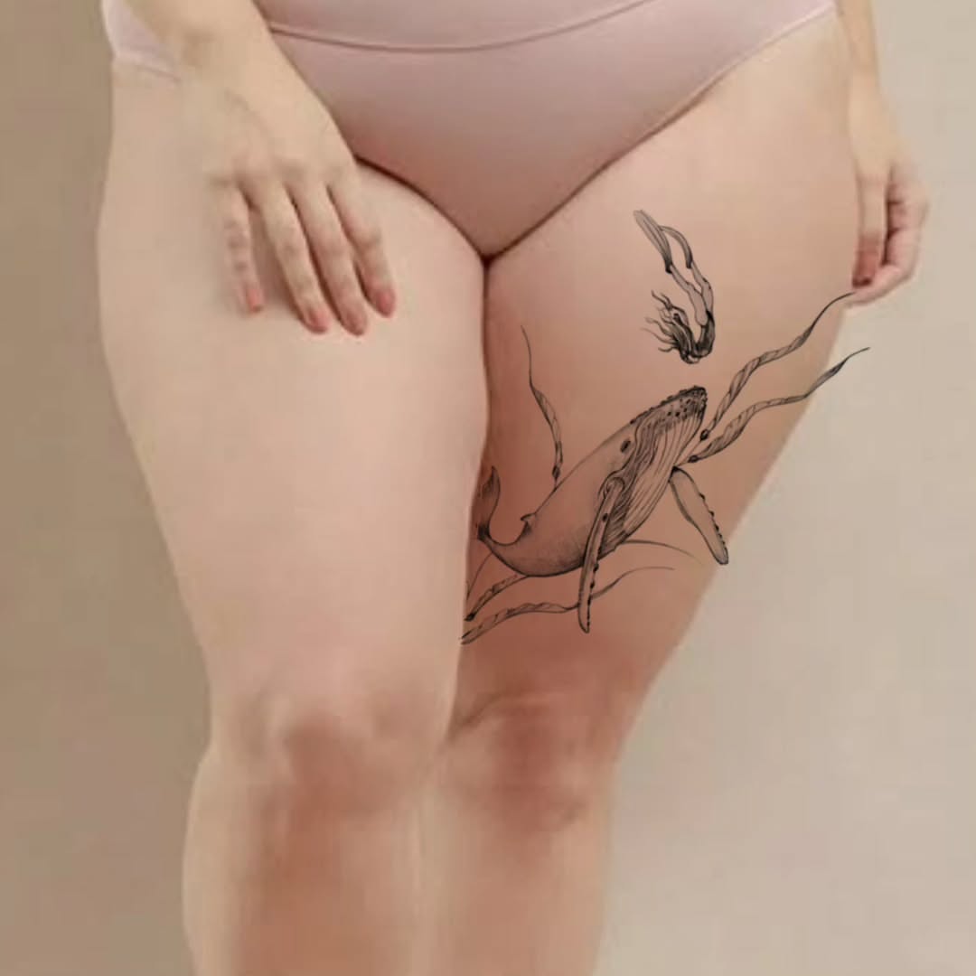 Whale and squid black and grey tattoo on the thigh by Tattoo artist - Luciana Dsilva, San Francisco, California