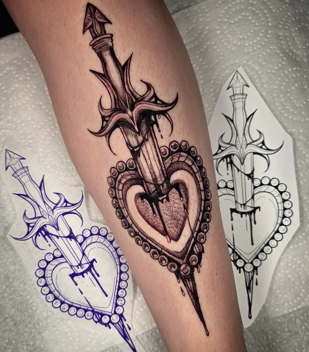 Heart with dagger dark realism tattoo on the forearm by Devin 🖤