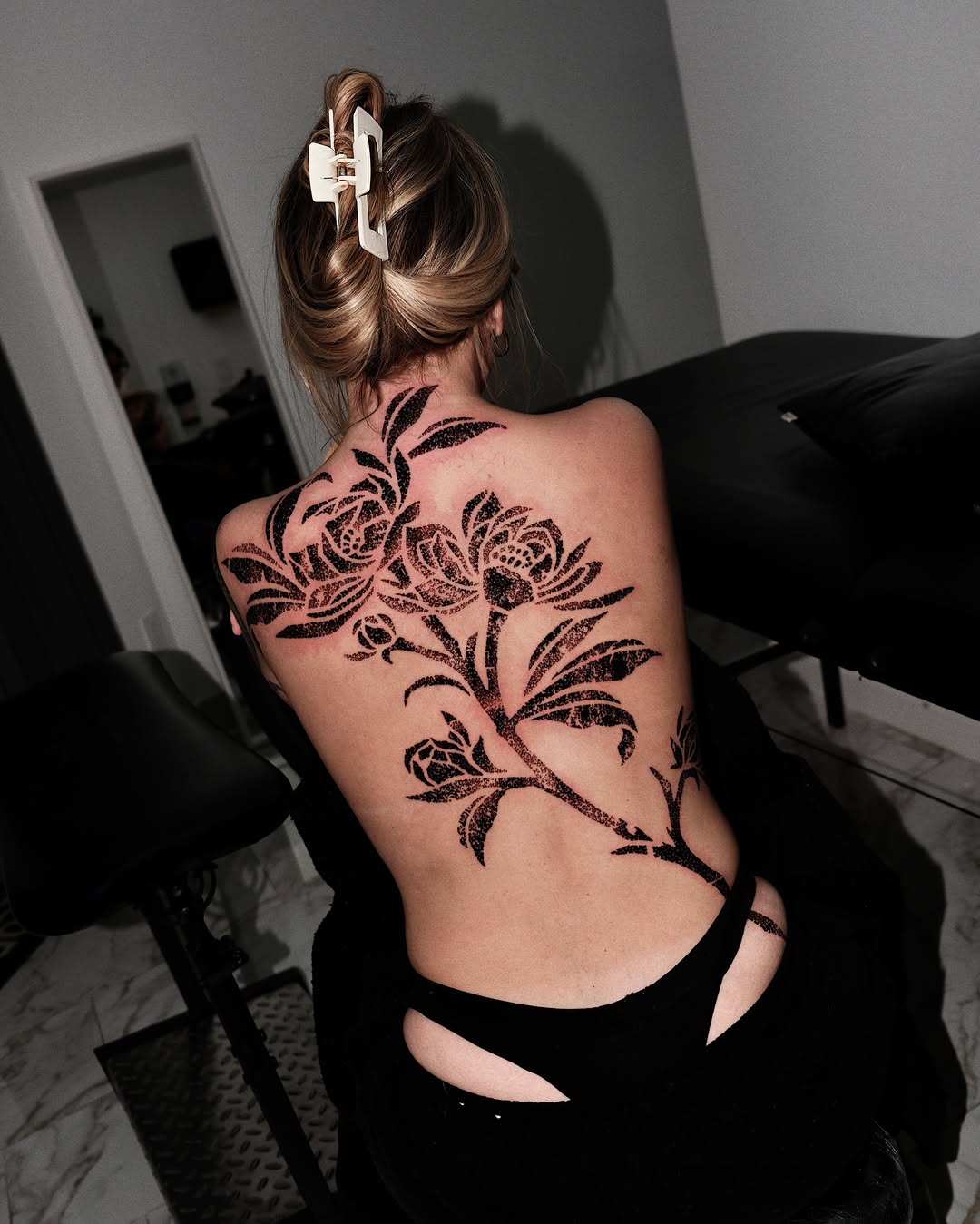Floral design black and grey tattoo on the back by Mooro