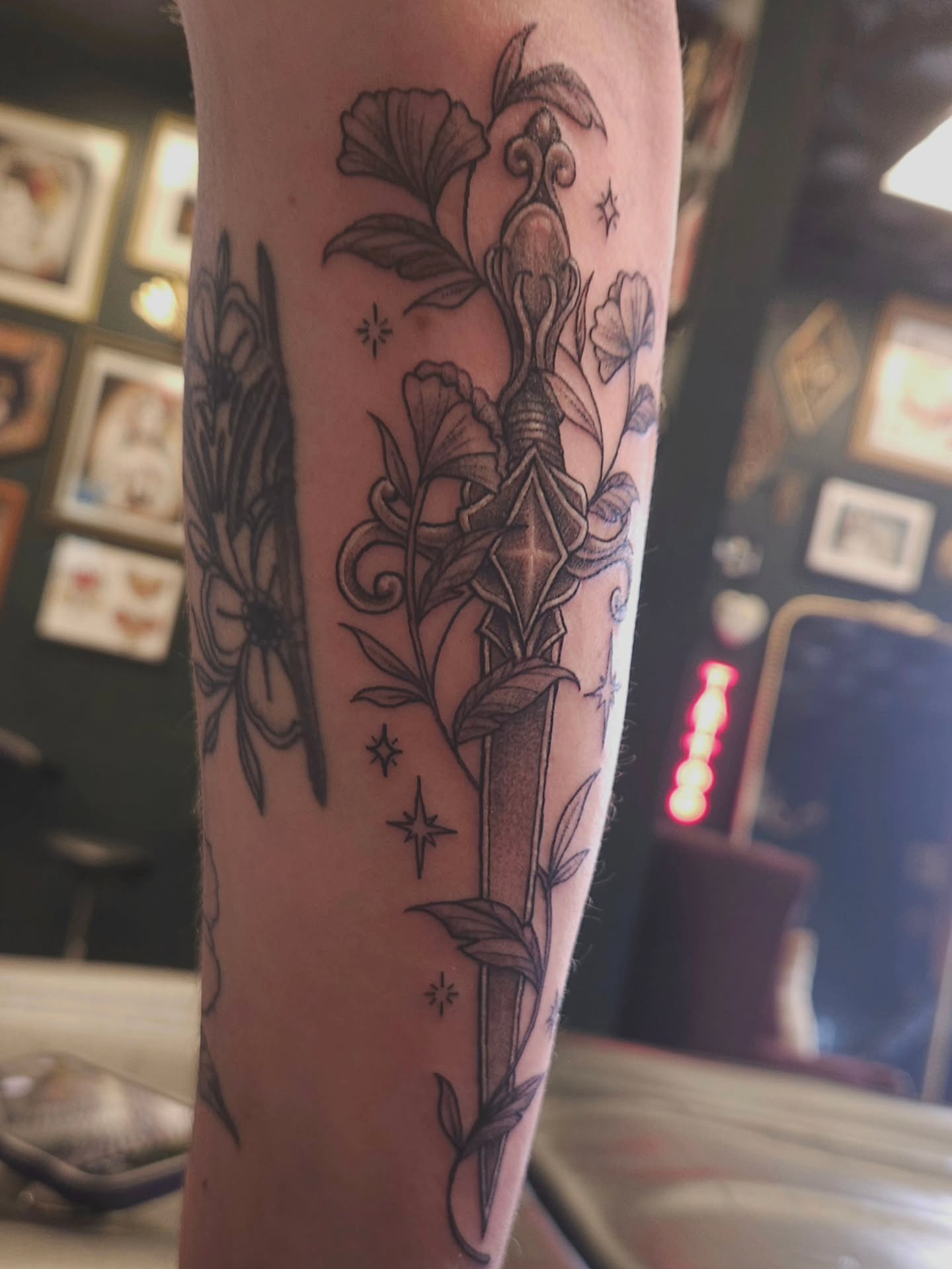 Sword and floral black and grey tattoo on the forearm by πΎπππππ πΎπππππ