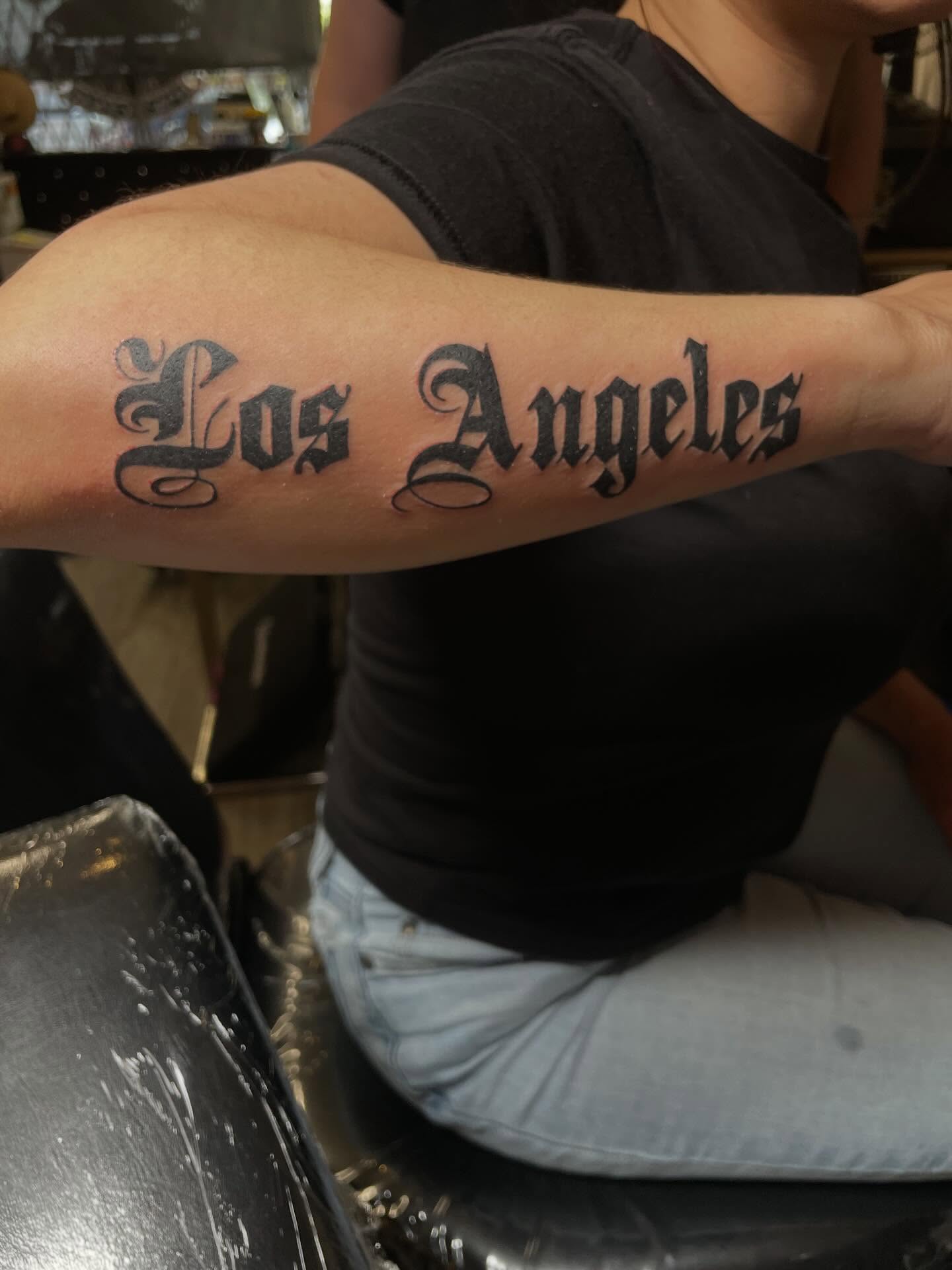Los Angeles lettering script tattoo on the forearm by πΎππππππππ