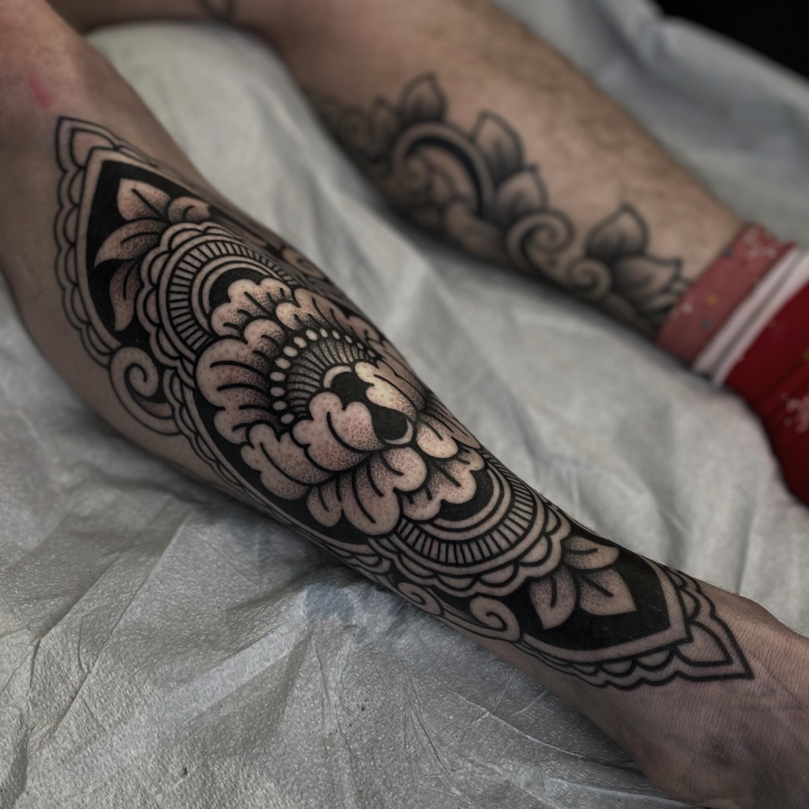 Floral mandala American traditional tattoo on the forearm by Veronica