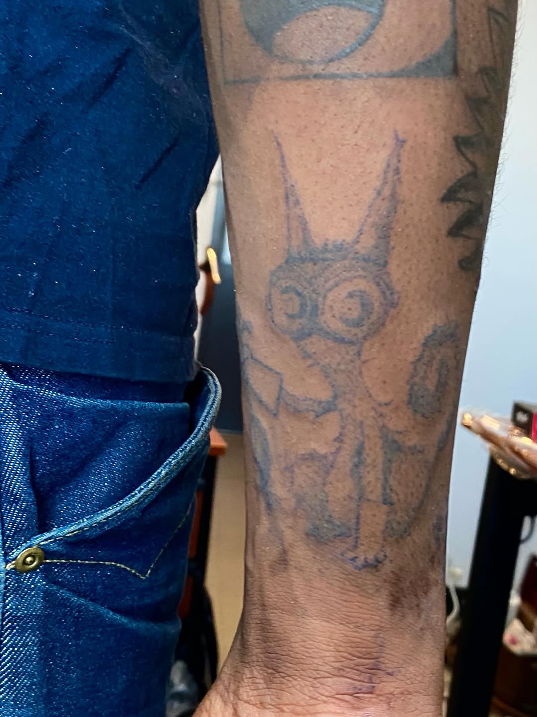 Stylized cat tattoo on the forearm by @feverfeverish