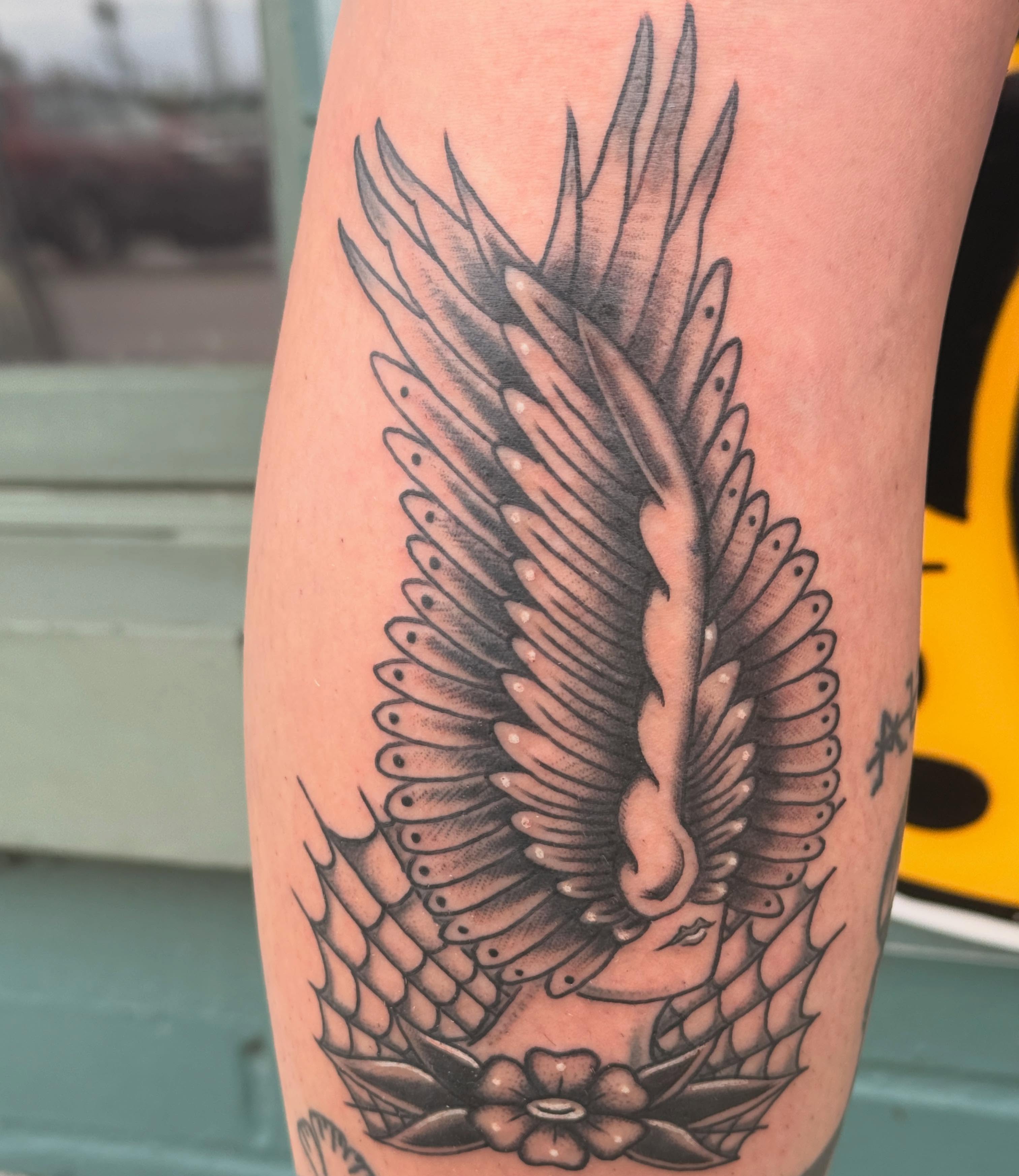 Wings black and grey tattoo on the forearm by Megan Sue Causemaker