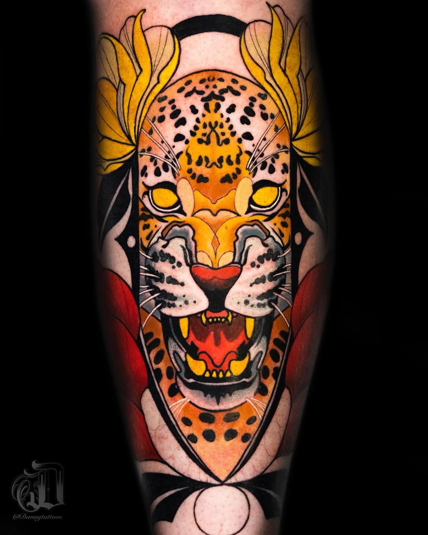 Leopard American traditional tattoo on the forearm by Danny Pando