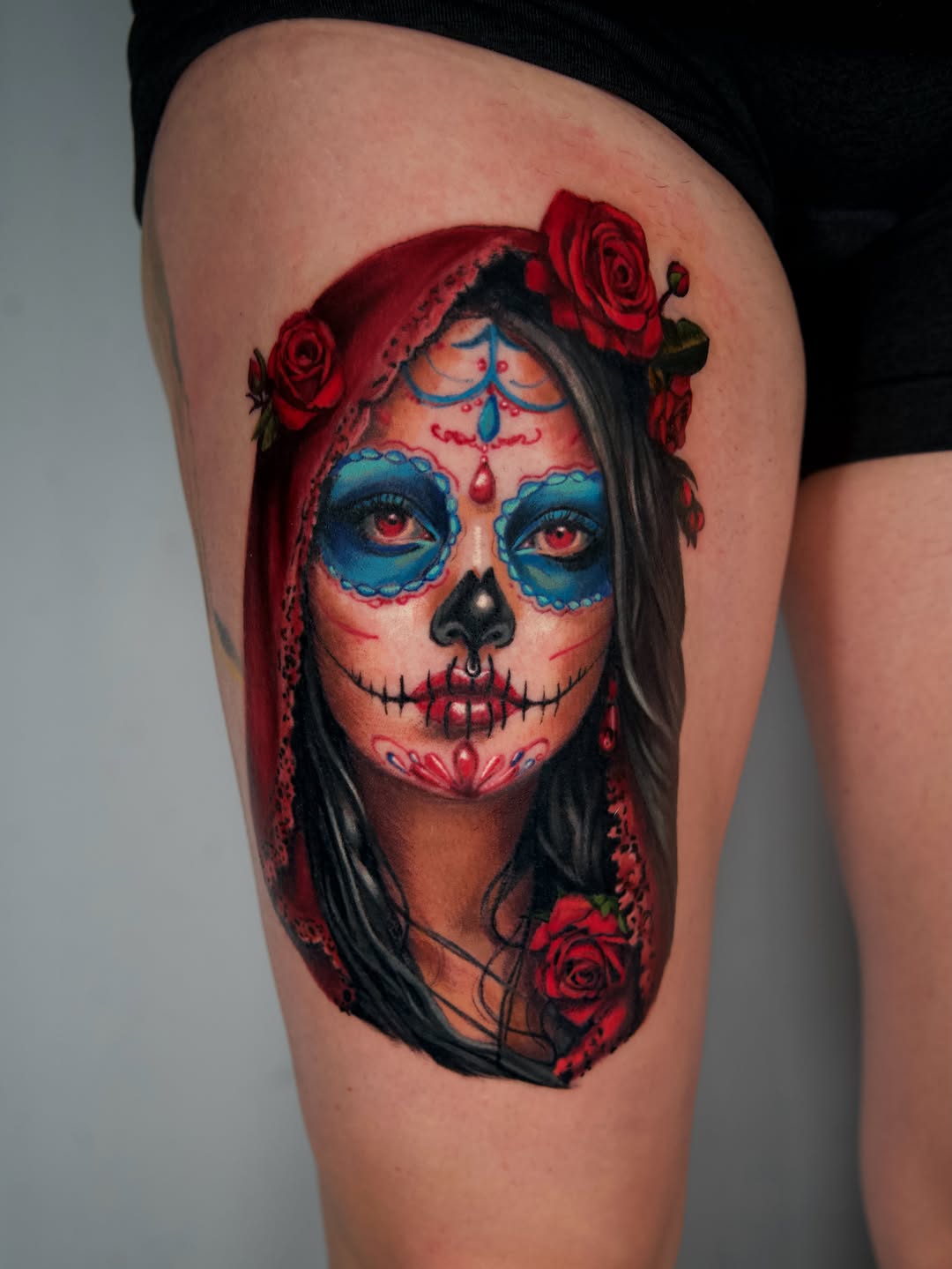 Surrealism tattoo on the thigh by Nate