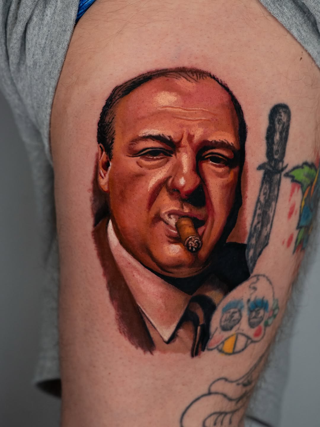 Portrait of Tony Soprano with cigar realism tattoo on the forearm by Nate