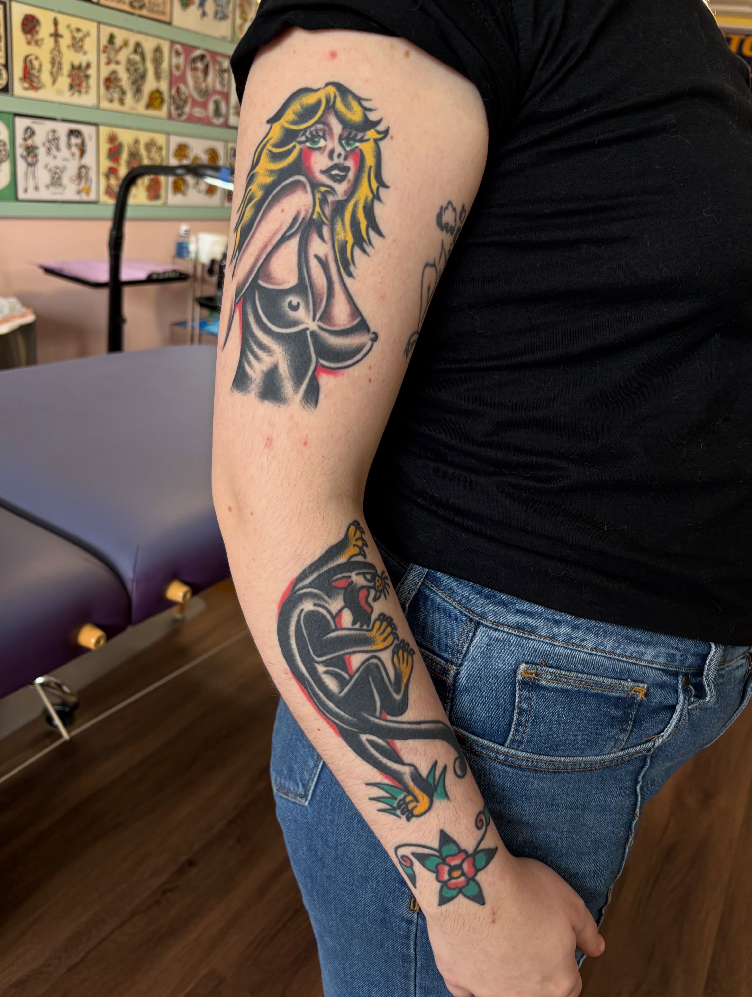 Woman with snake American traditional tattoo on the forearm by Traditional Tattooing