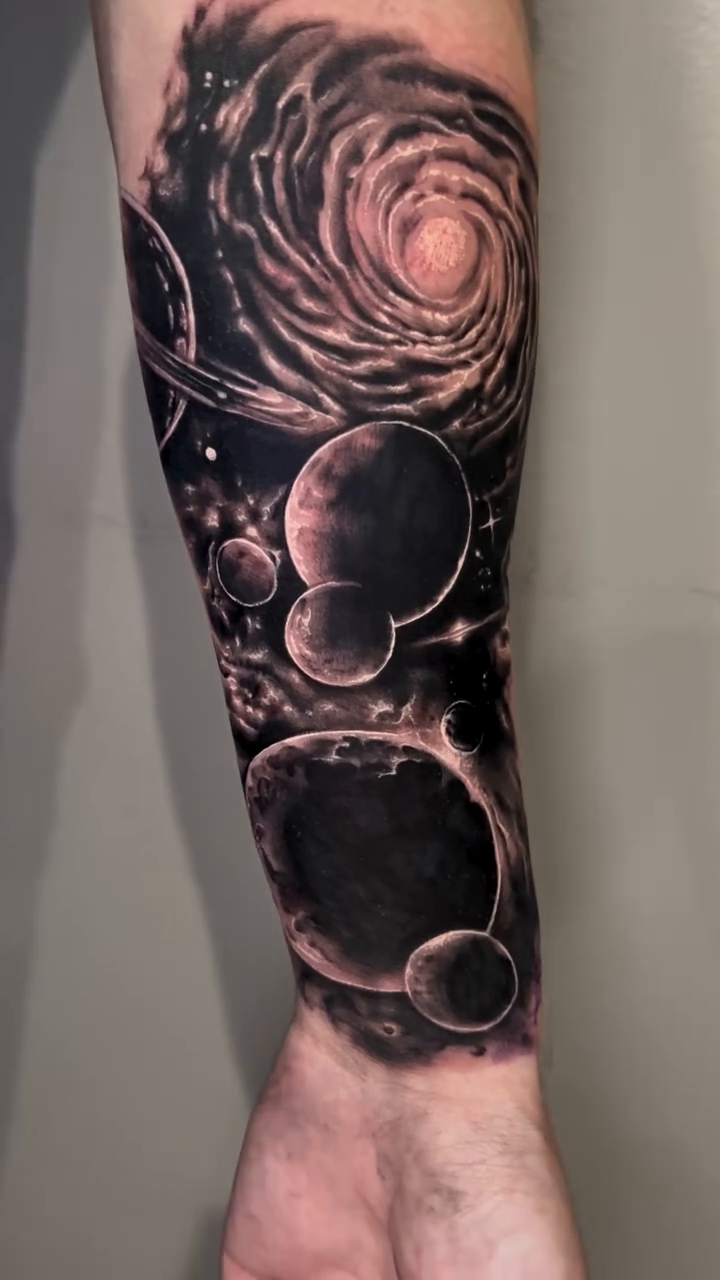 Dark art tattoo on the forearm by Eddie Wolfe