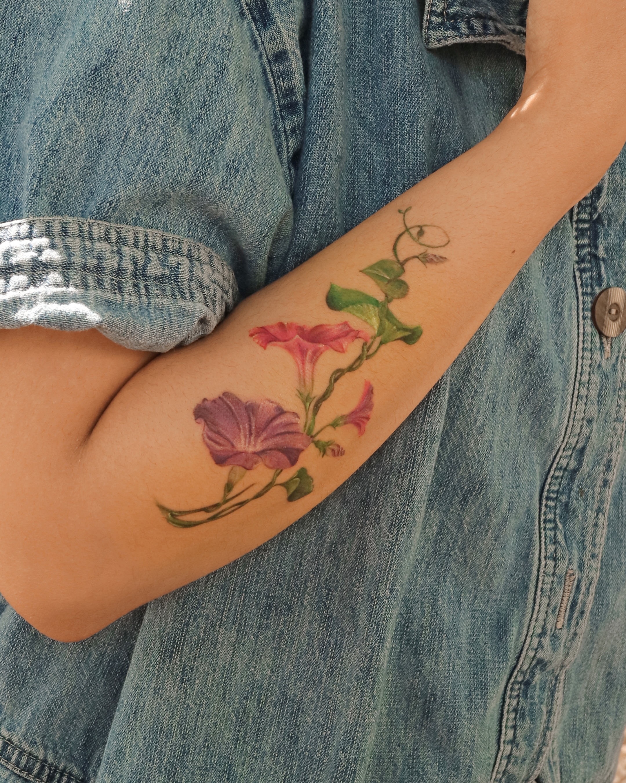Morning glory flowers realism tattoo on the forearm by Aroha