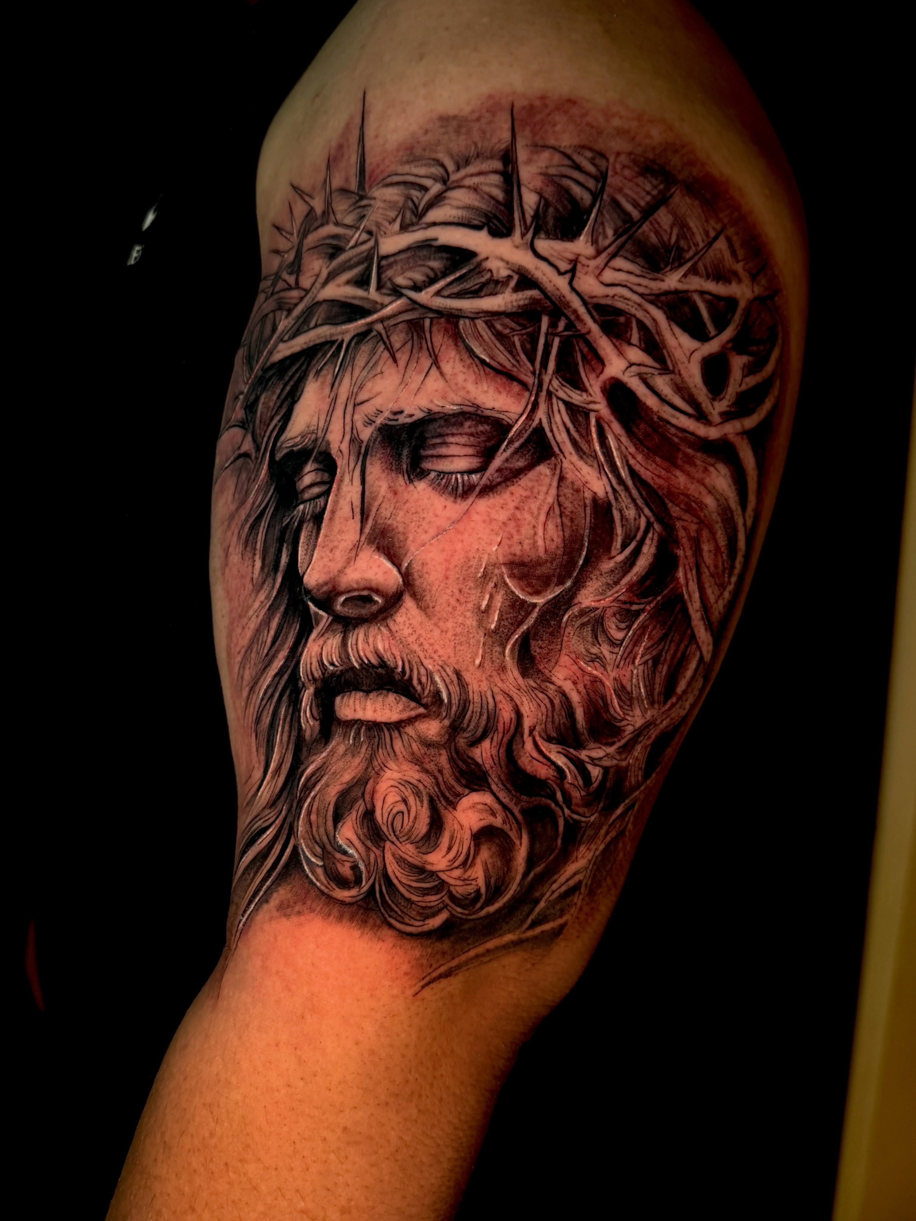 Jesus Christ realism tattoo on the shoulder by Caloy Obra