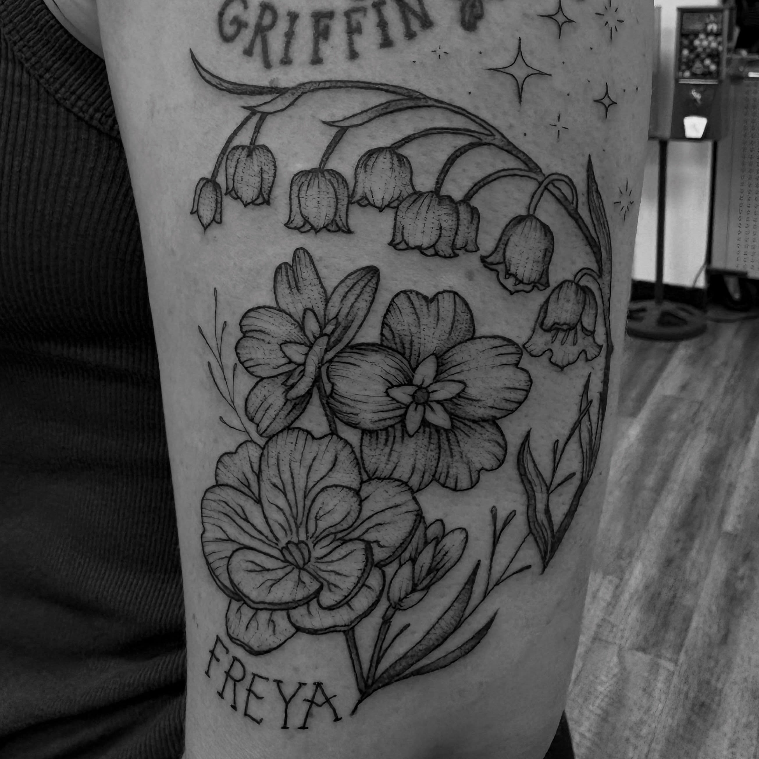 Flowers and lily of the valley black and grey tattoo on the forearm by Jason Allen, Avondale, Arizona