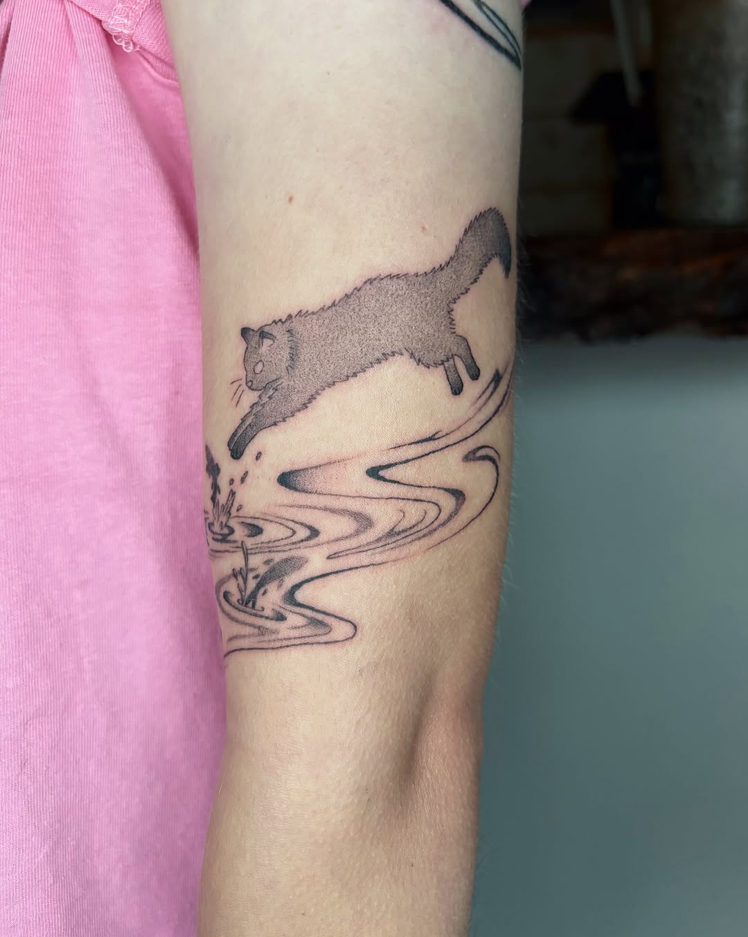 Cat jumping black and grey tattoo on the forearm by Abigail, San Francisco, California