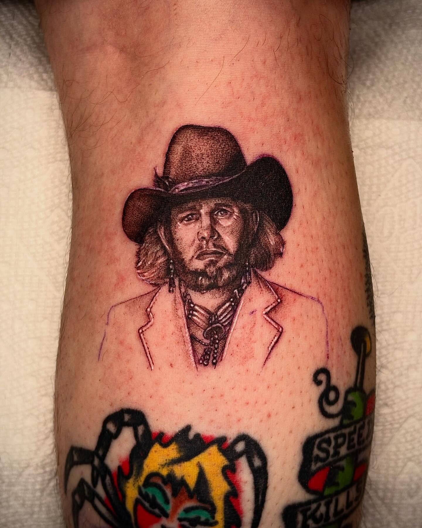 Cowboy portrait realism tattoo on the forearm by Emily Falkowski
