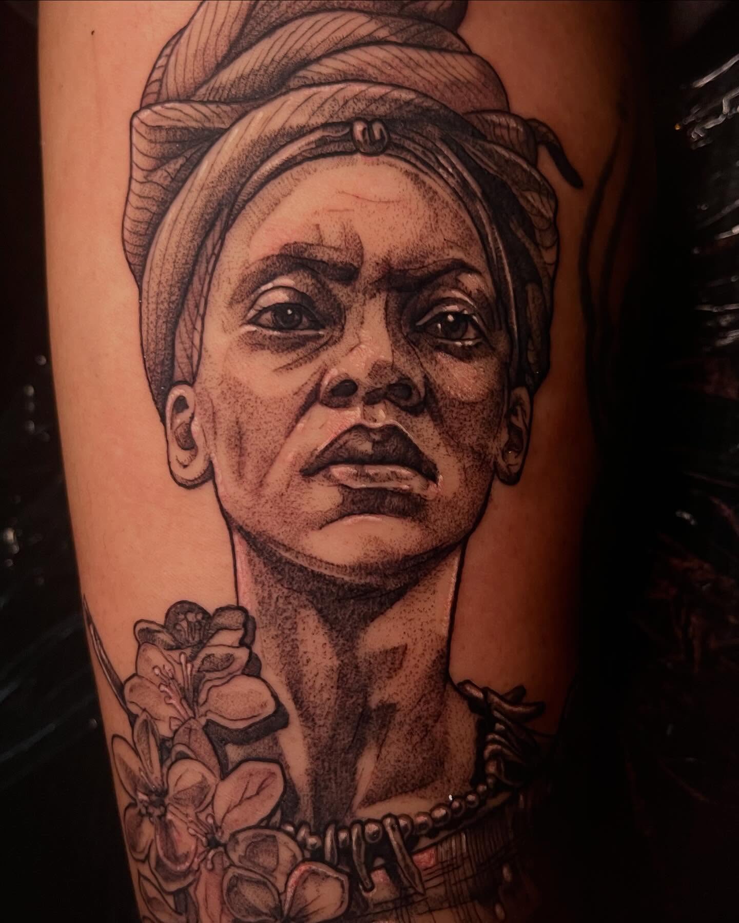 Portrait of a woman dotwork tattoo on the forearm by Emily Falkowski