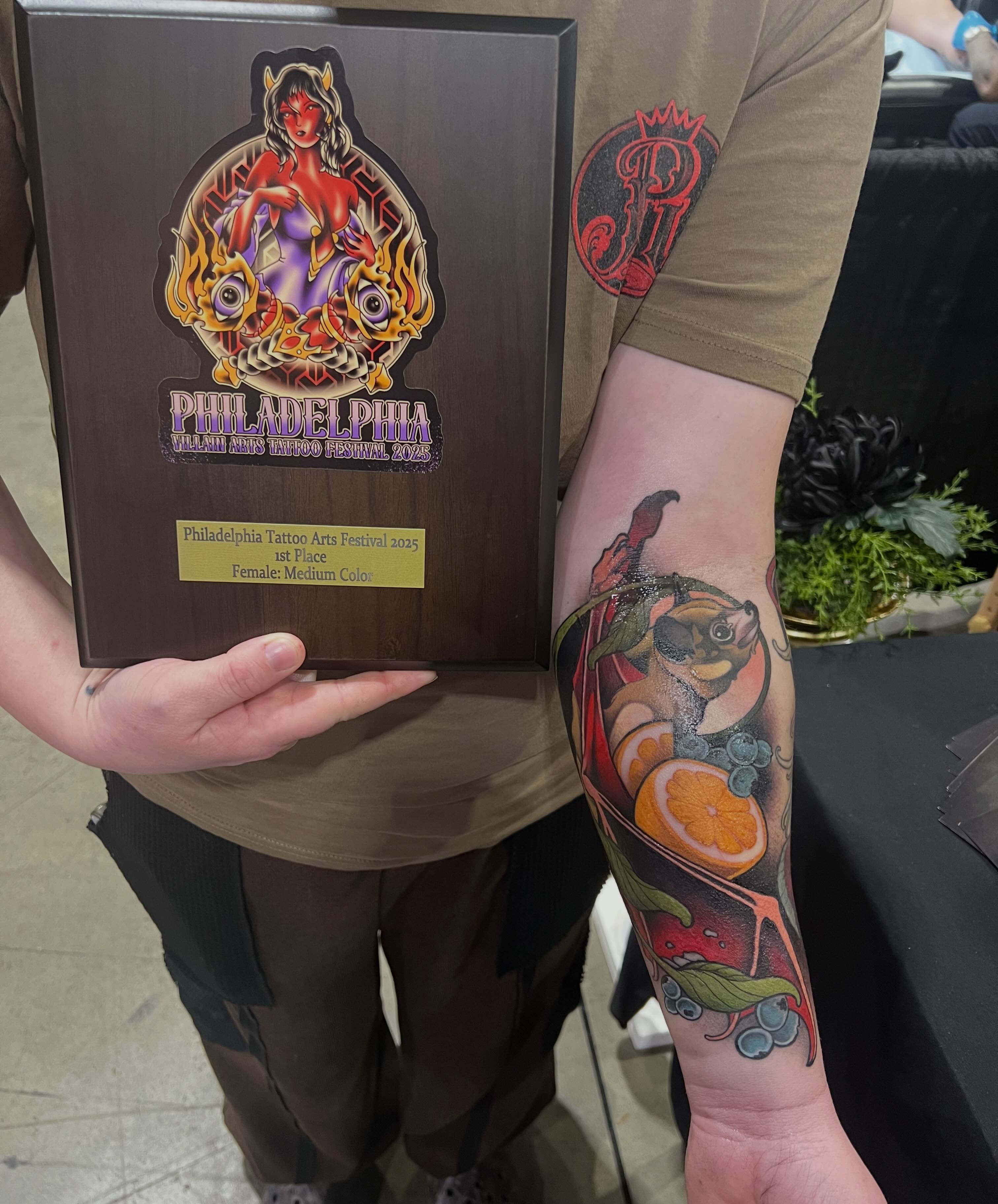 Fruit and squirrel new school tattoo on the forearm by Skyler Miller