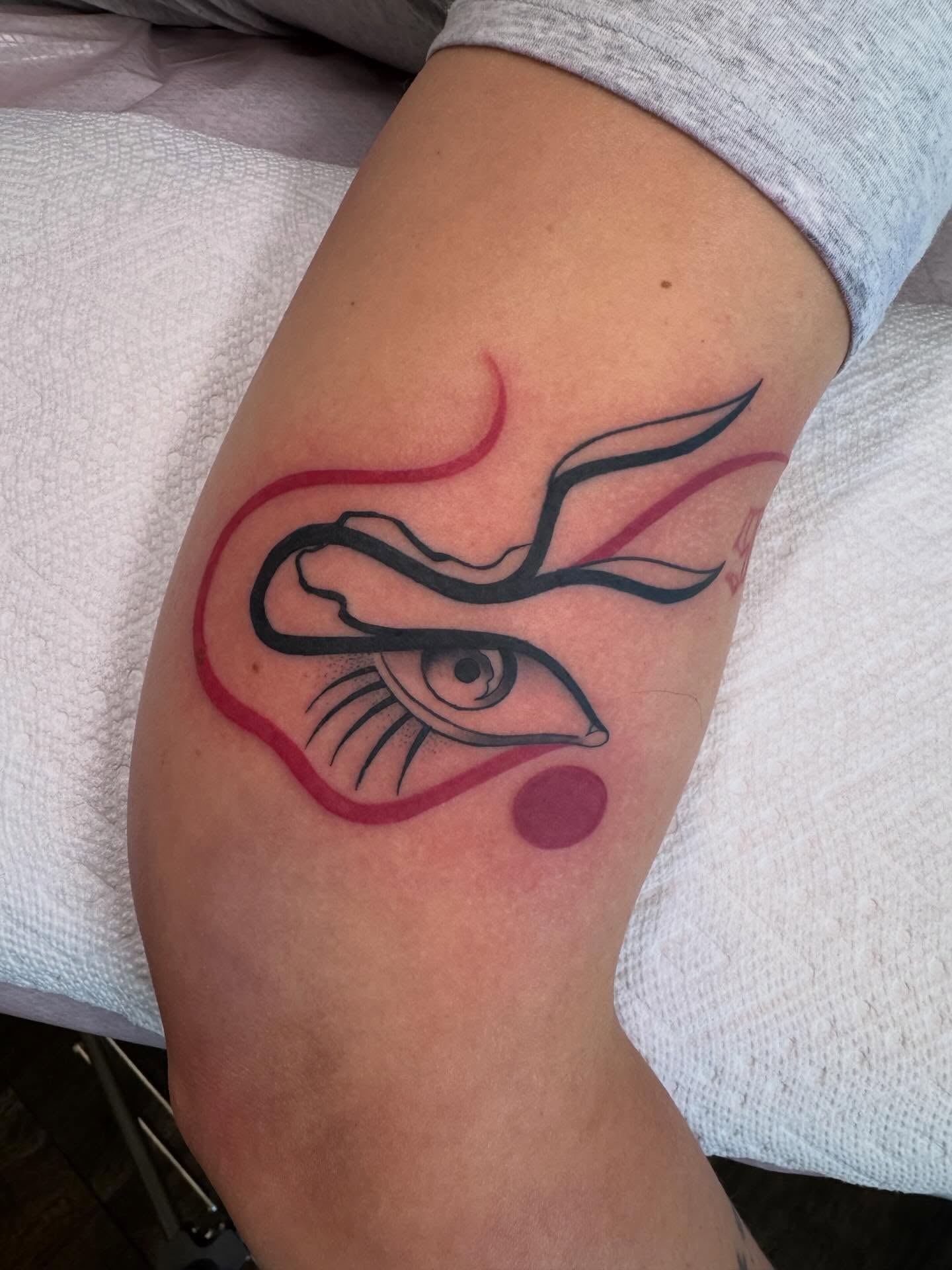 Eye with wings geometric tattoo on the forearm by Paul Giovis