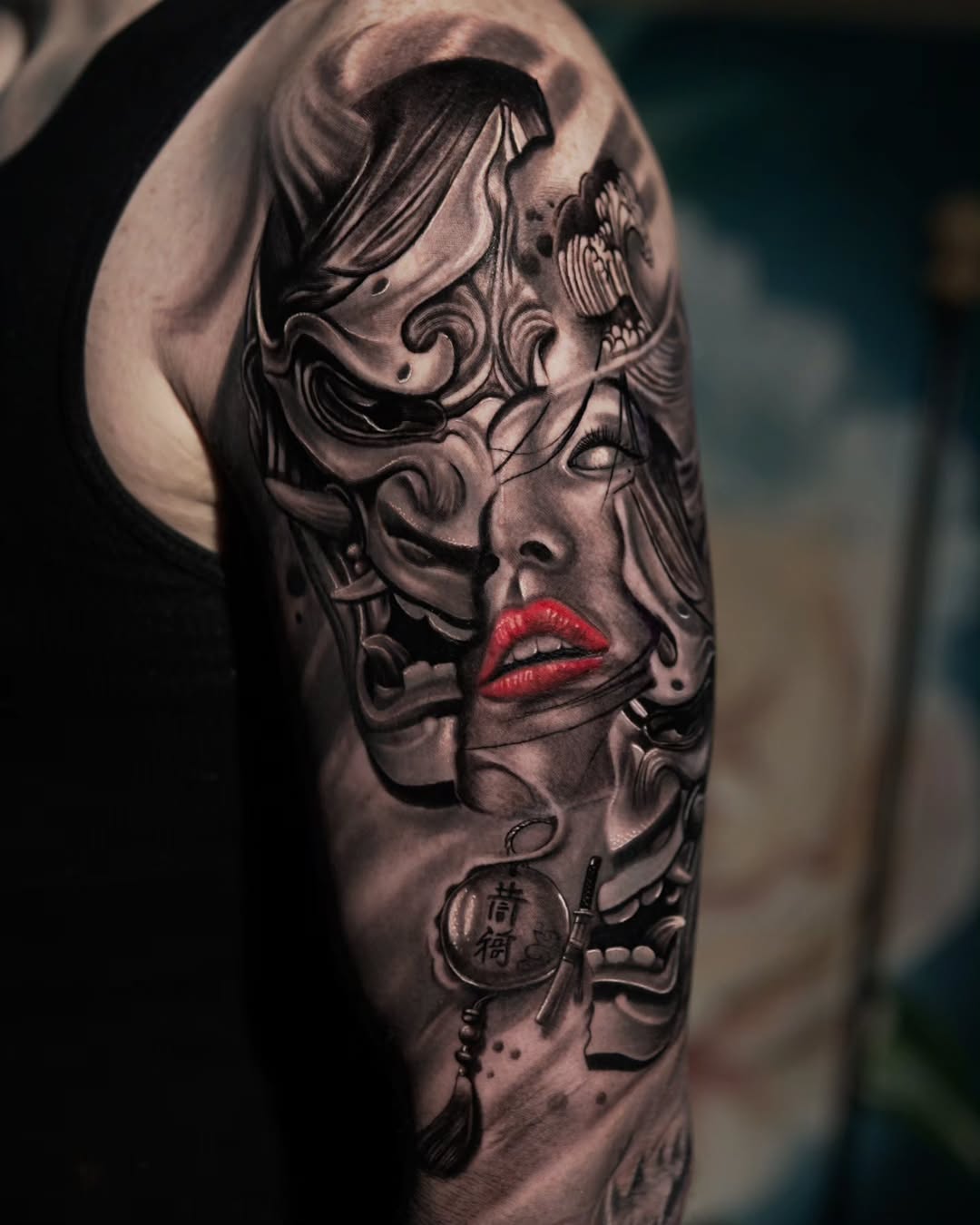 Geisha mask and face Japanese tattoo on the shoulder by Baxtertattoo