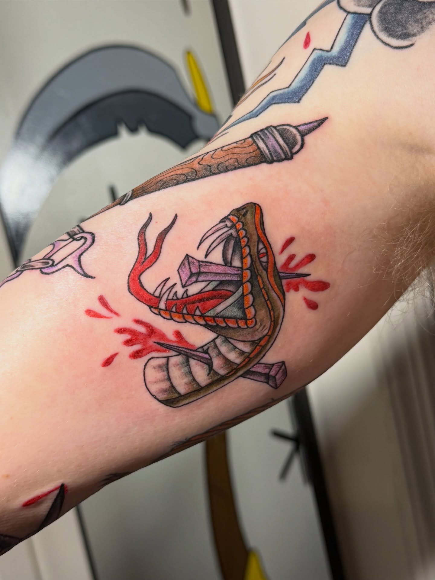Snake American traditional tattoo on the forearm by Sophia, New Carlisle, Ohio