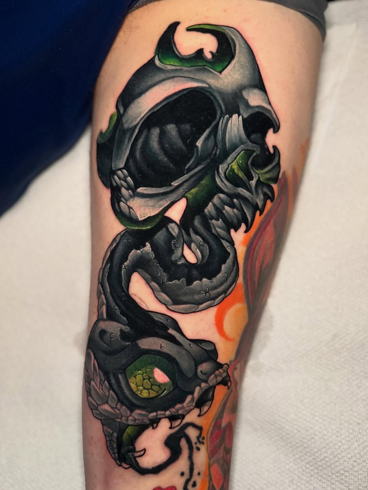 Skull and snake dark realism tattoo on the forearm by BigTatty Kayne