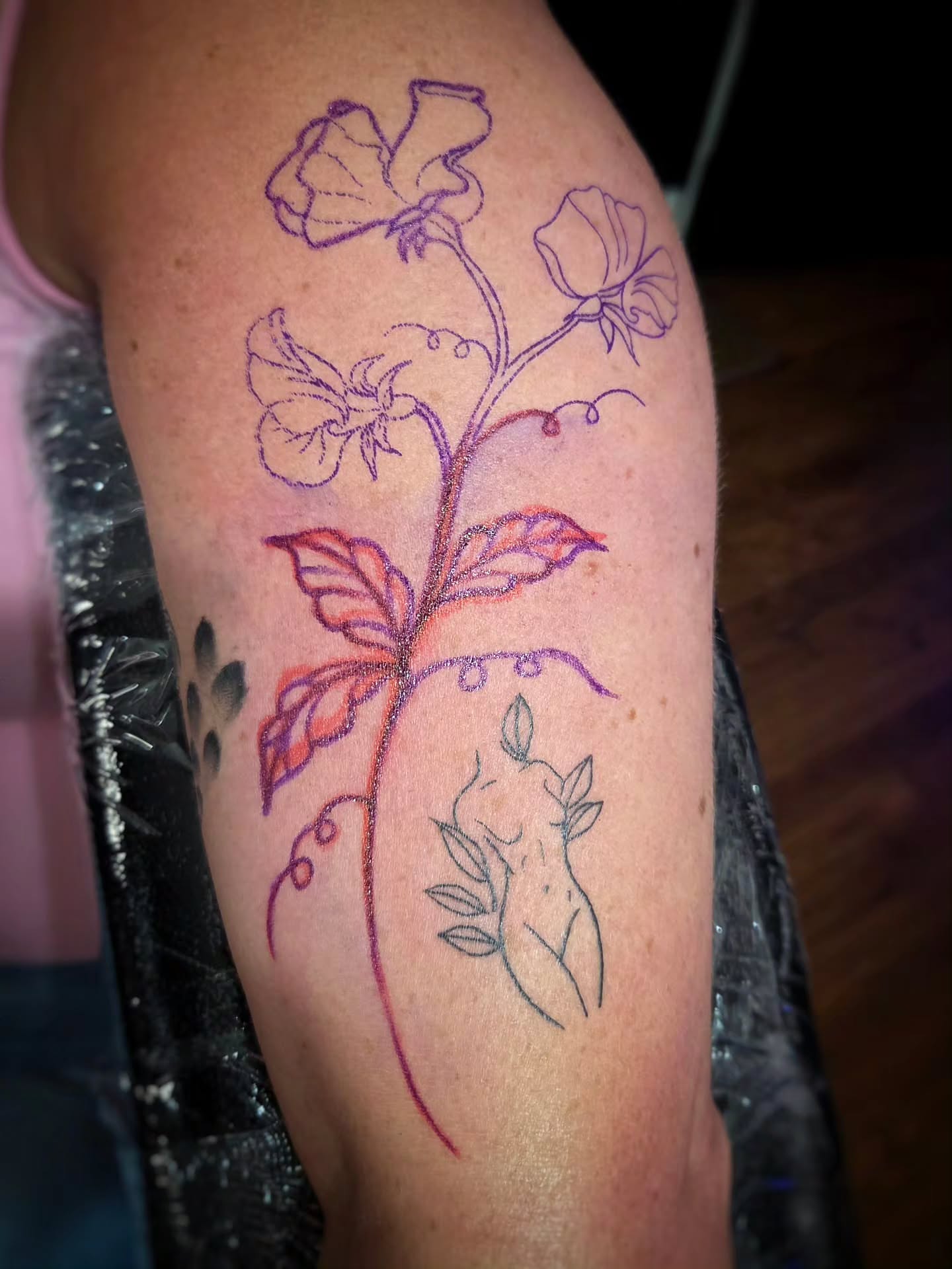 Flower vine fine line tattoo on the thigh by Jam ⚡️🐉🖤