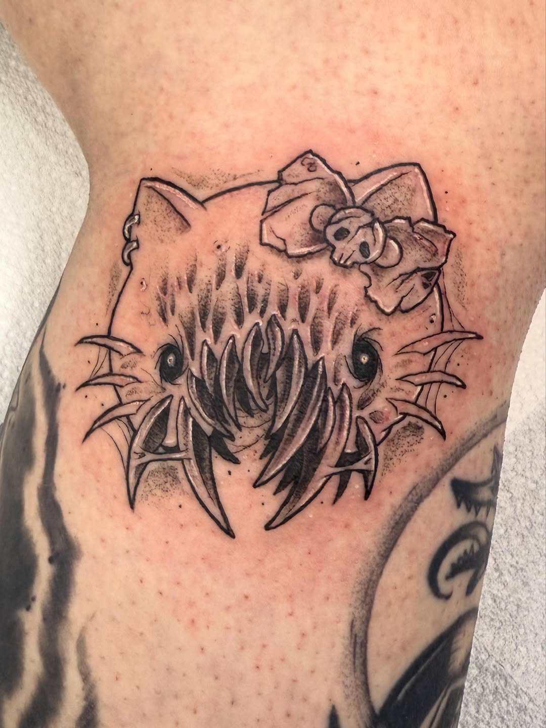 Tattoo by @bennwho_tattoo — dark_realism, black_and_grey