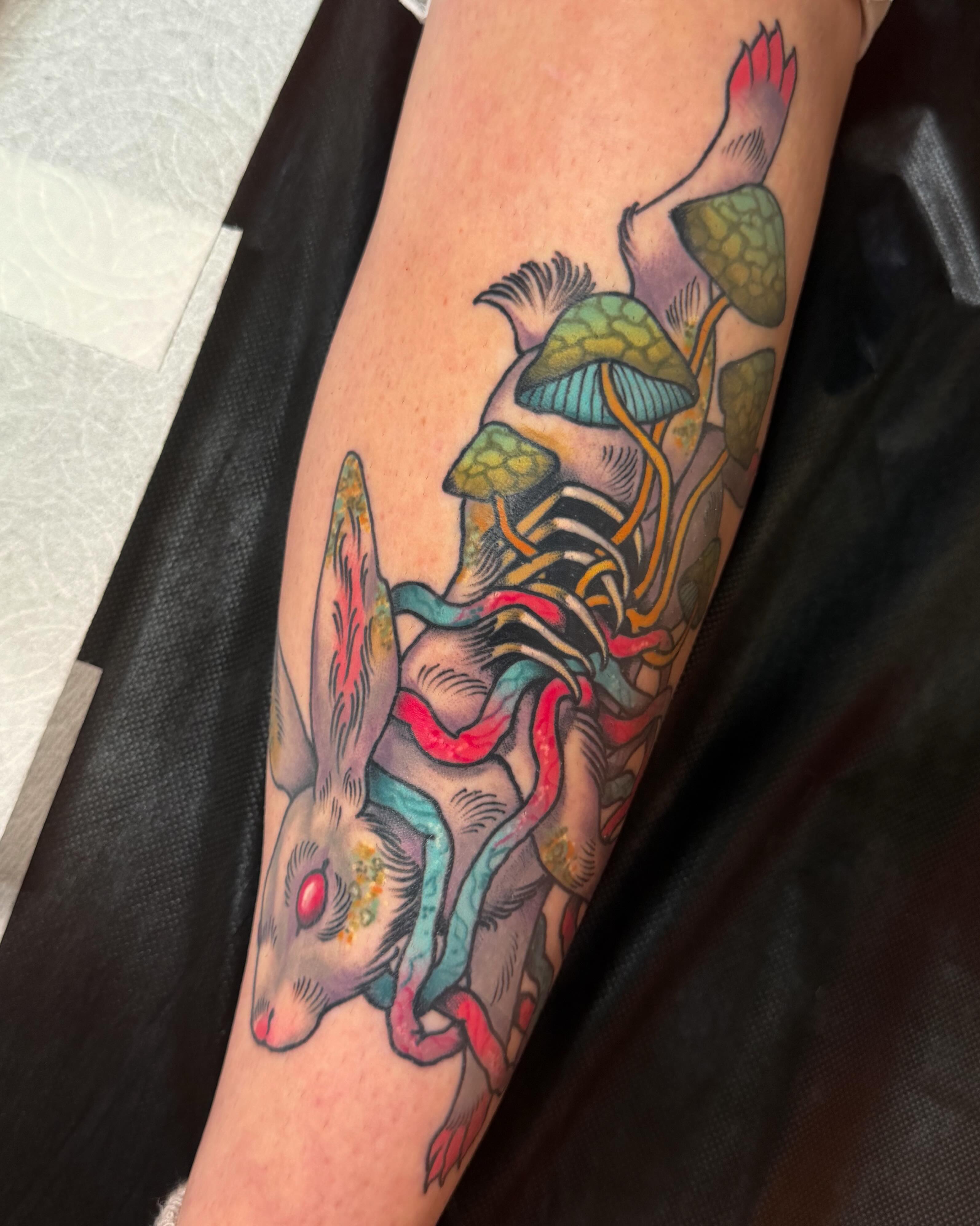 Rabbit and mushrooms new school tattoo on the forearm by Monica Amneus