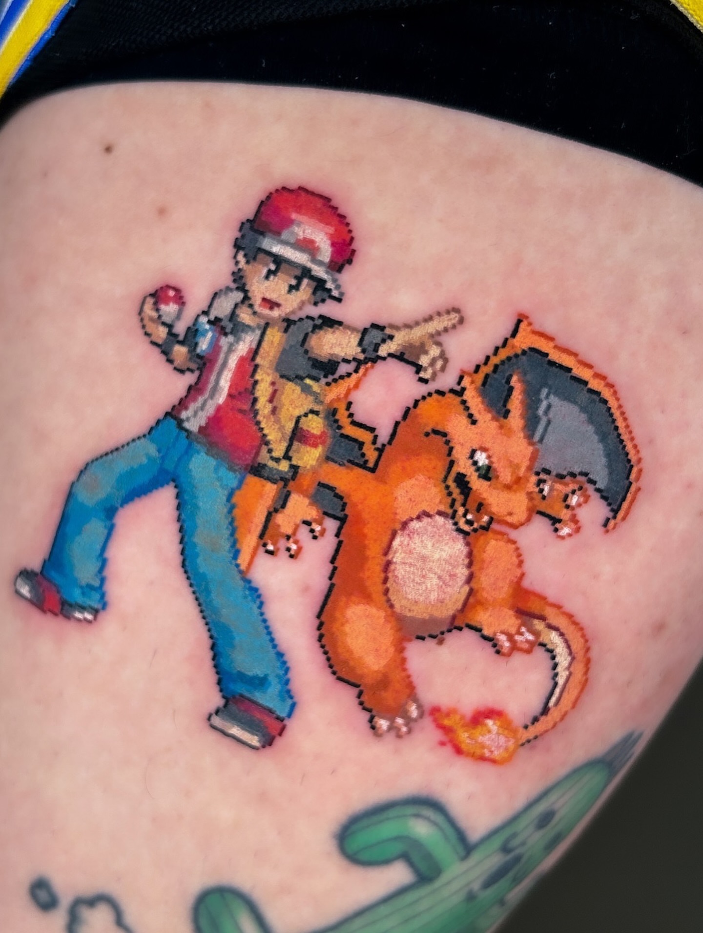 Charmander and trainer dotwork tattoo on the upper arm by m r p i x e l ๐ธ๐ฌ