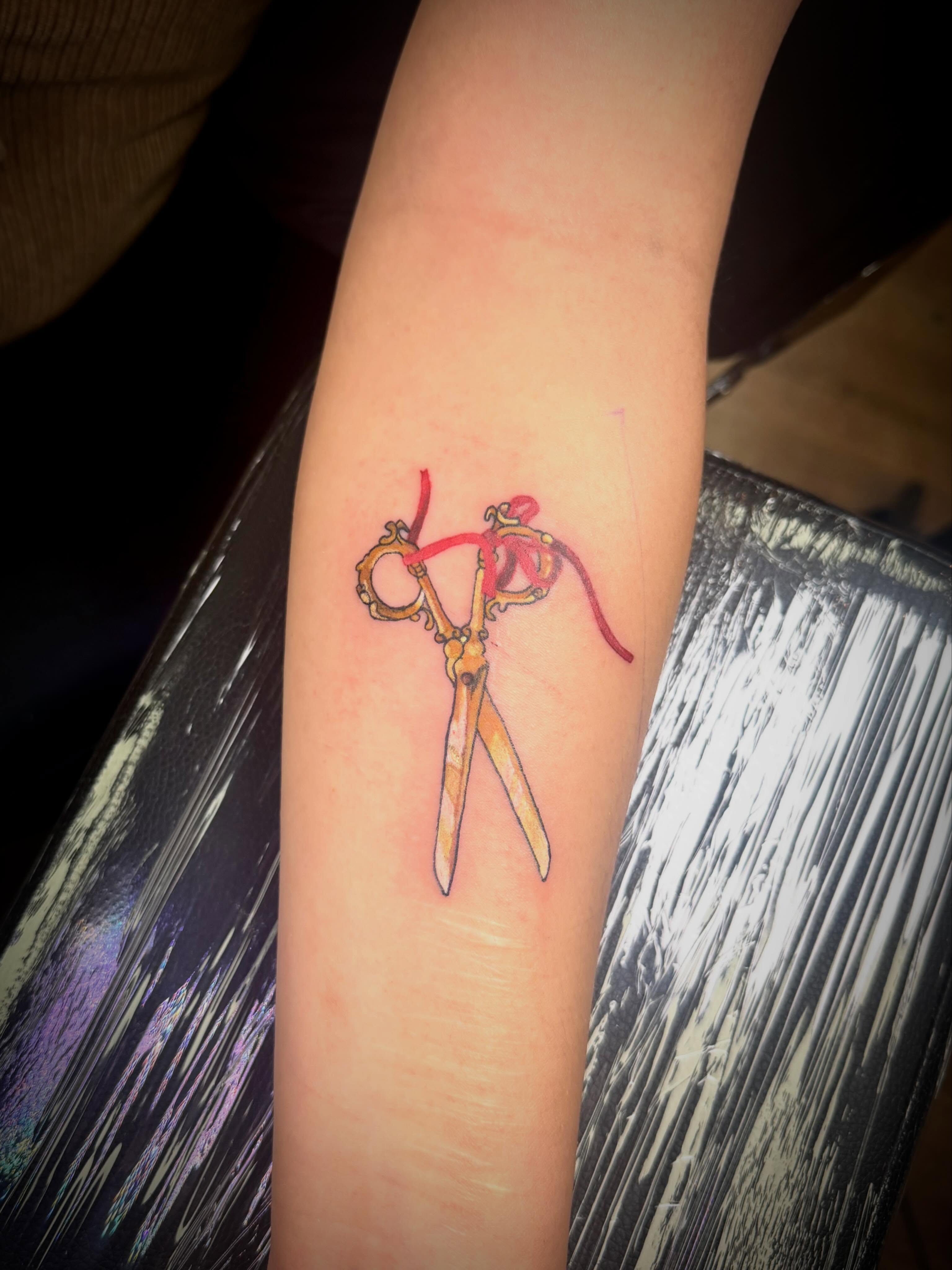Scissors realism tattoo on the forearm by Mikey