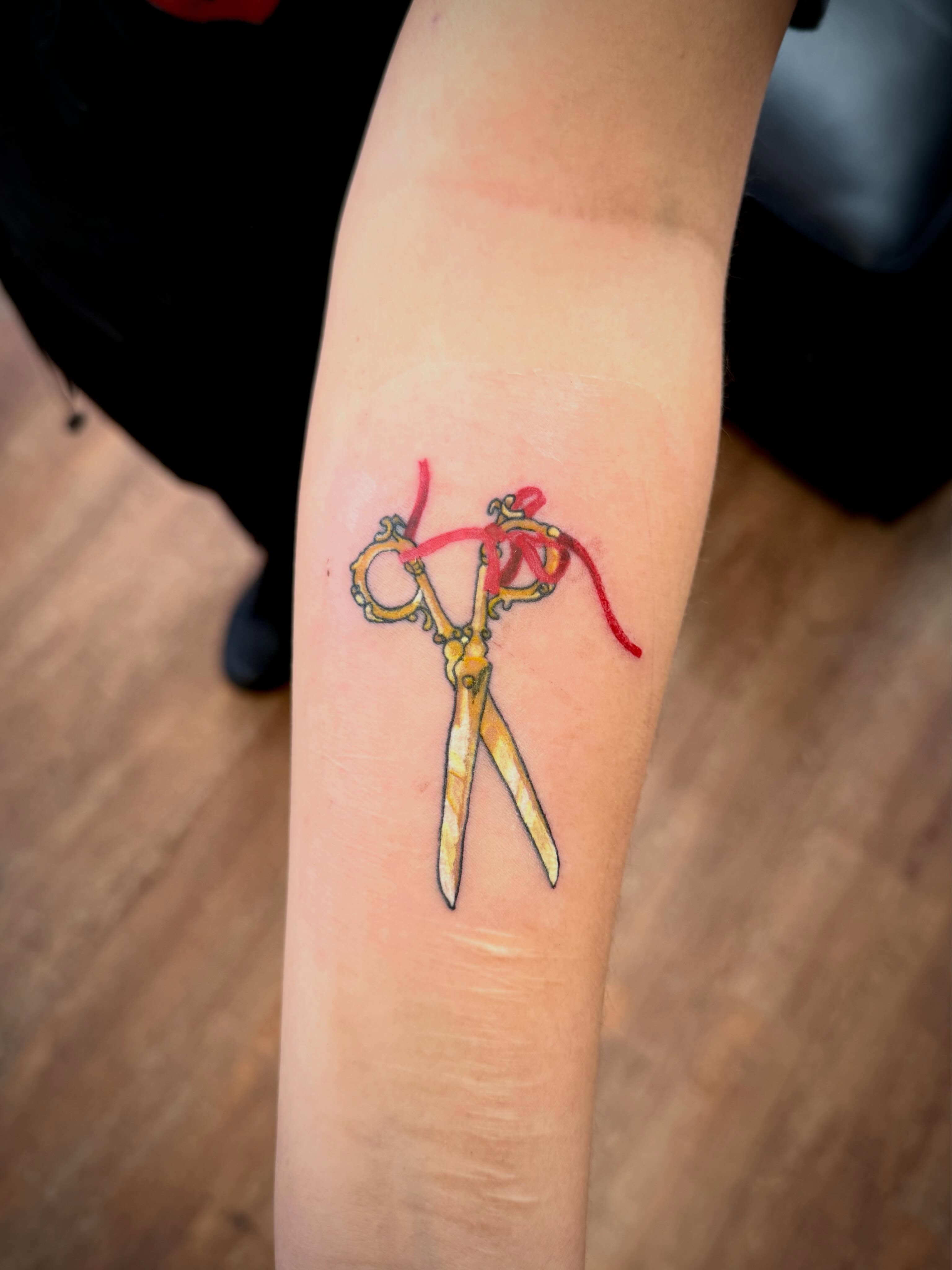 Scissors realism tattoo on the forearm by Mikey