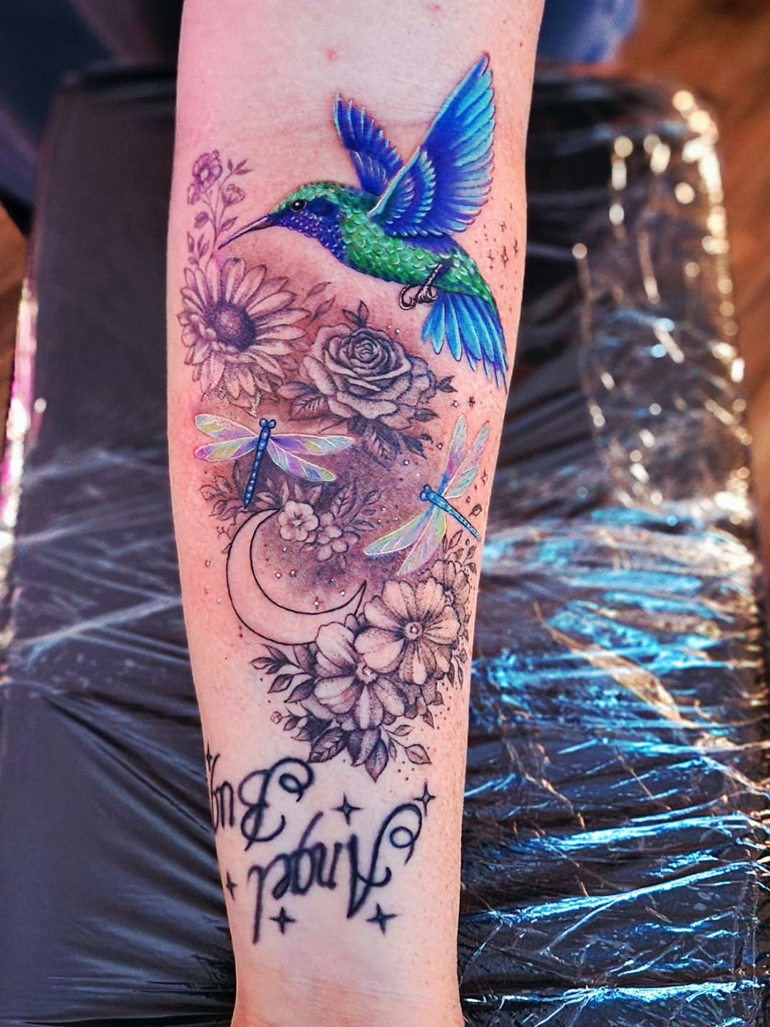 Hummingbird and flowers dotwork tattoo on the forearm by Luke Jordan Ink, Louisville, Colorado