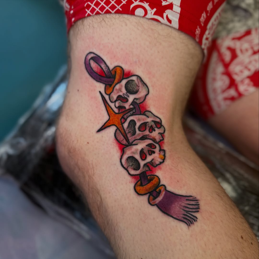 Skulls and ribbon American traditional tattoo on the forearm by Ramón Silva