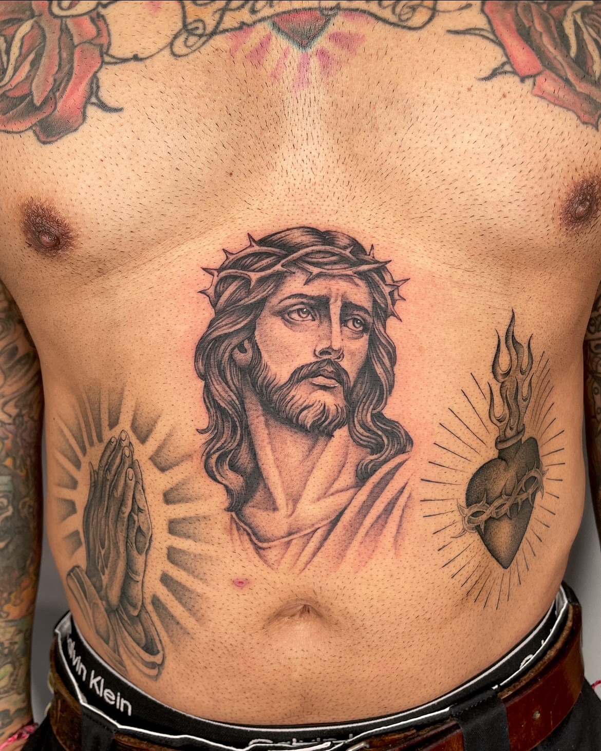 Religious figure realism tattoo on the chest by IVY