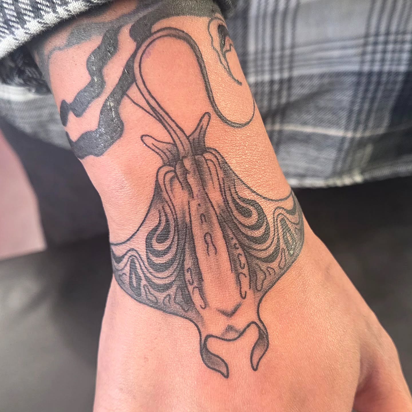 Octopus black and grey tattoo on the forearm by Kat Coniglio Art