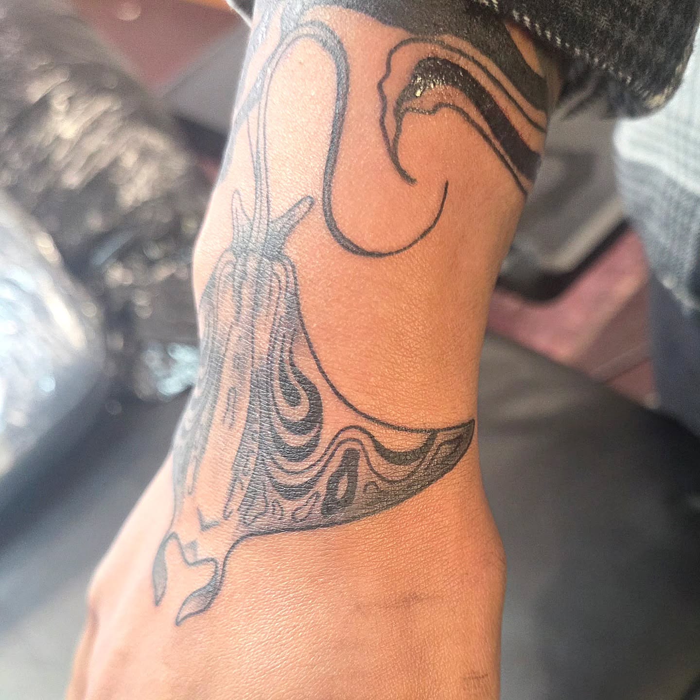 Abstract shape black and grey tattoo on the forearm by Kat Coniglio Art