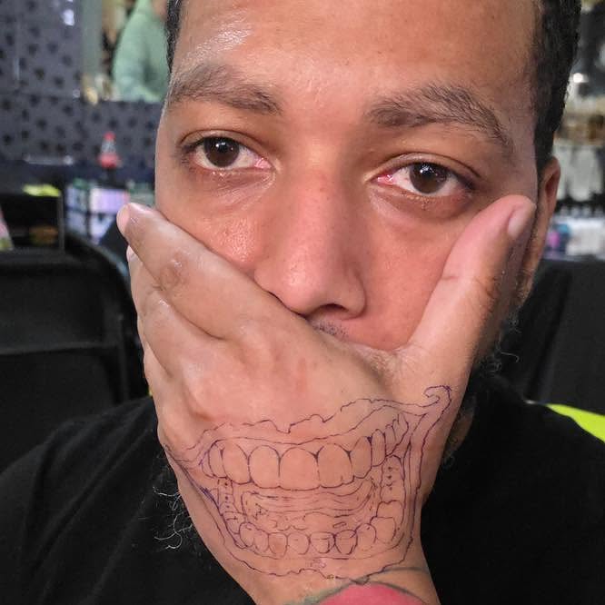 Teeth realism tattoo on the neck by Tank Maass