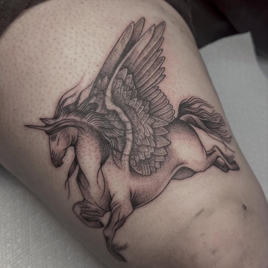 Pegasus fine line tattoo on the thigh by Lia Massari