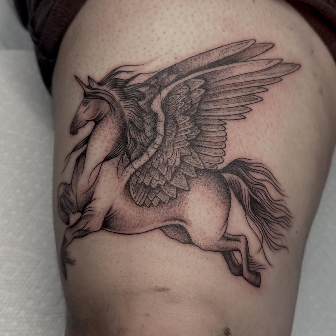 Pegasus fine line tattoo on the thigh by Lia Massari