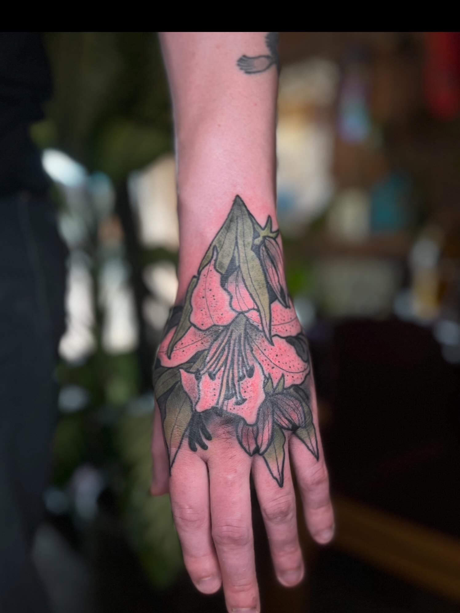 Rhododendron American traditional tattoo on the hand by Kaichi Fujita, Eugene, Oregon