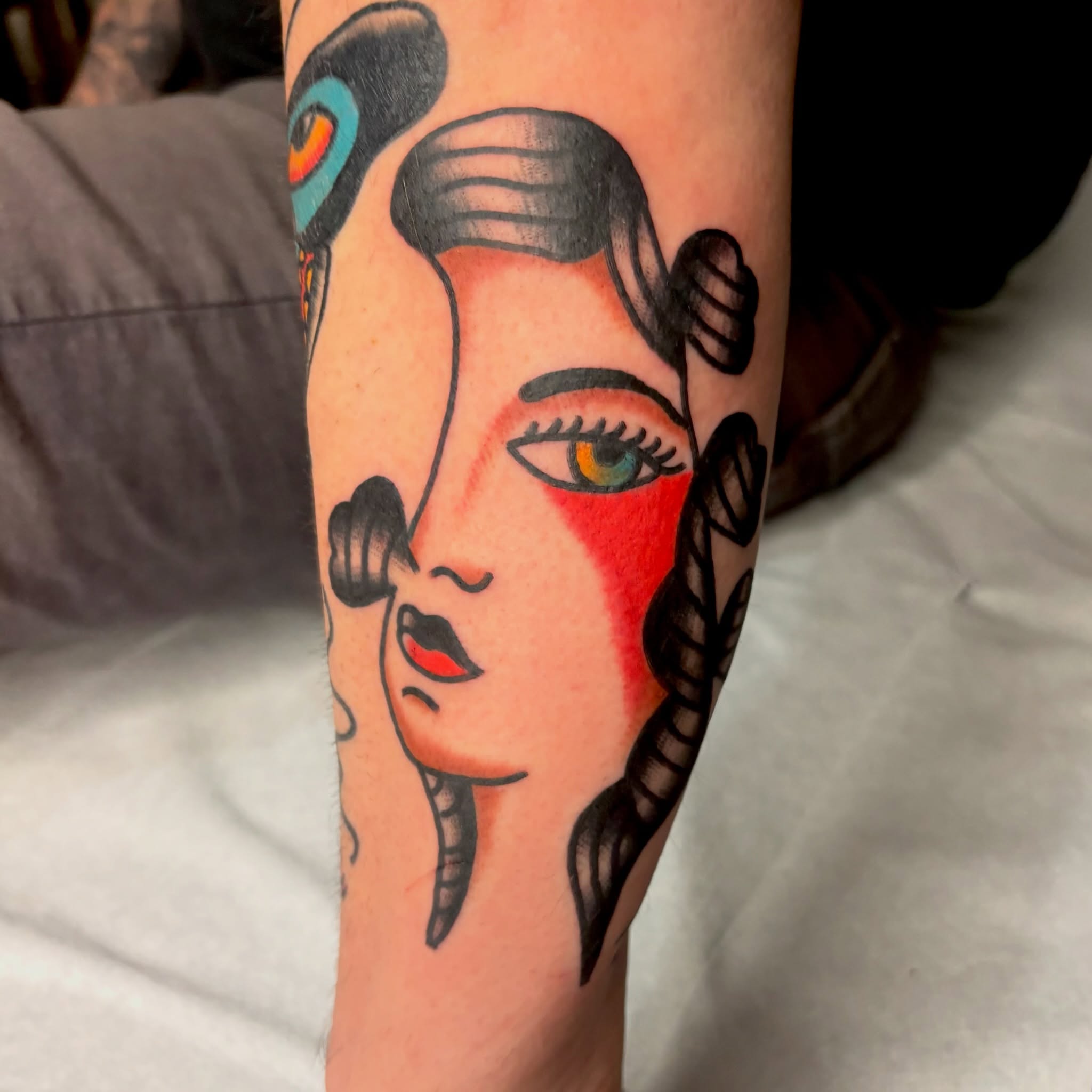 Woman's face American traditional tattoo on the forearm by Braedon 🎱