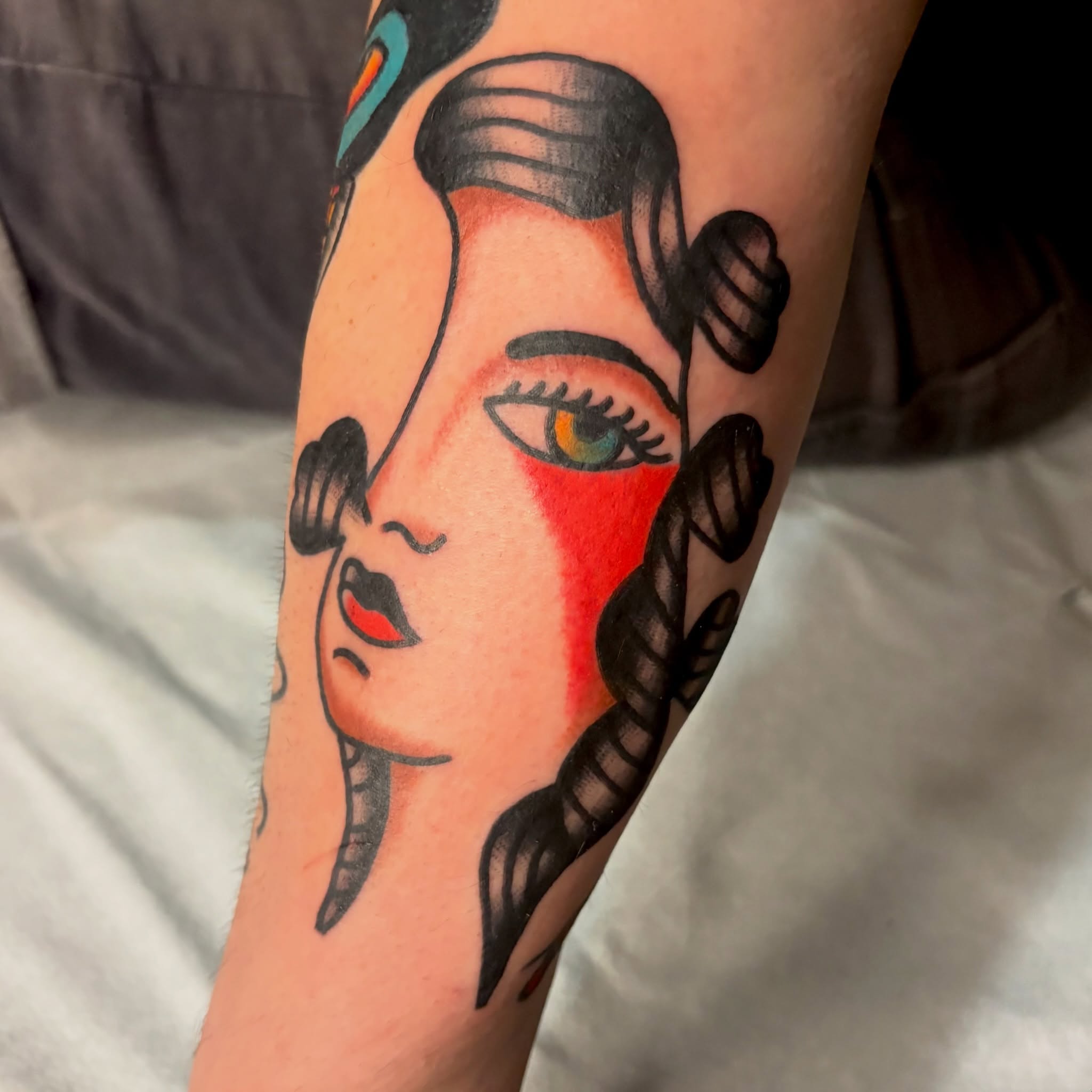 Woman's face American traditional tattoo on the forearm by Braedon 🎱