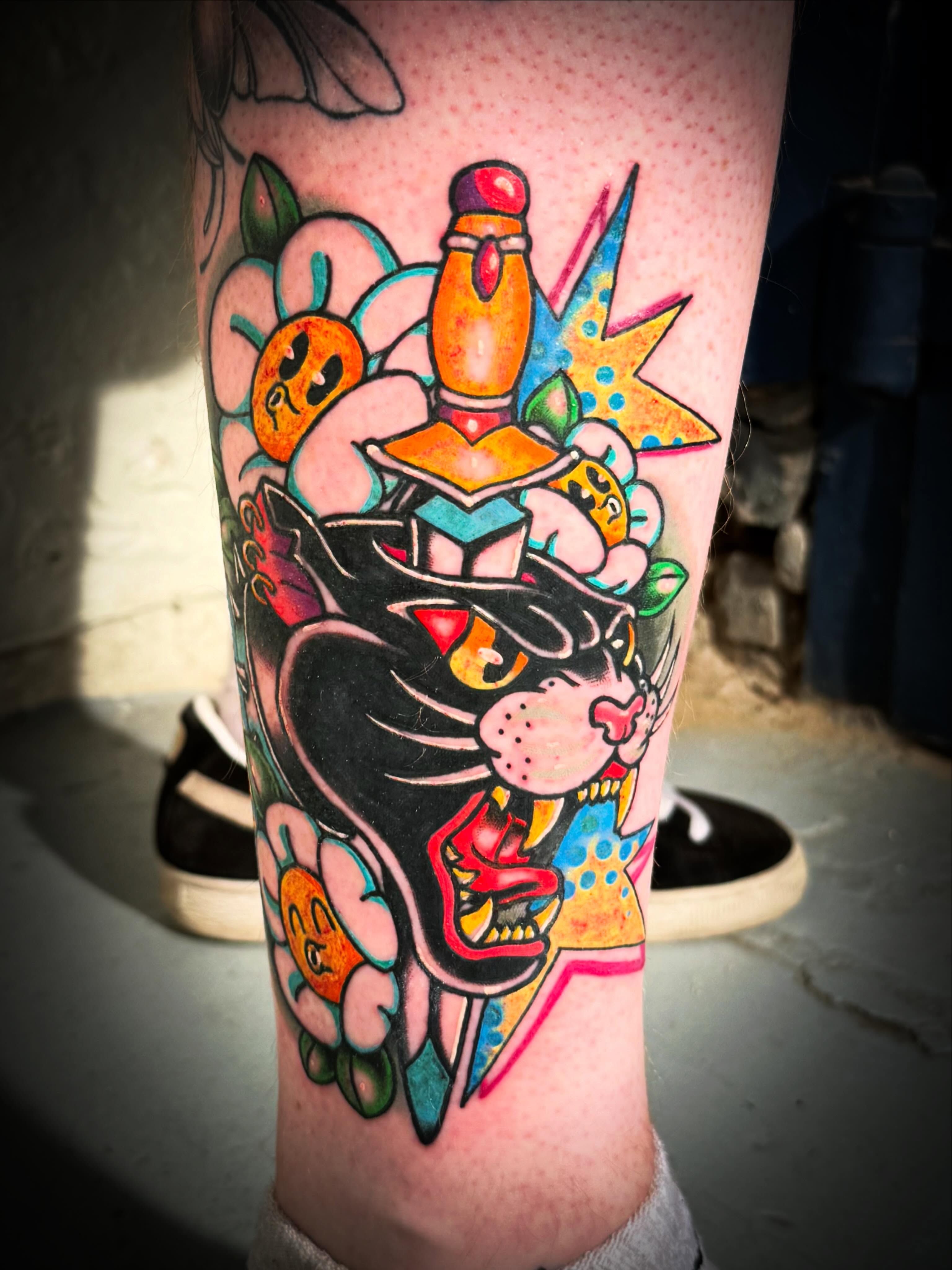 Cat and flowers American traditional tattoo on the forearm by Mackz